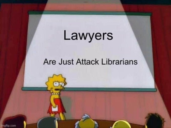 A screenshot of Lisa from The Simpsons, standing in front of a whiteboard giving a presentation to seated listeners. Text on the whiteboard says, "LAWYERS are just attack librarians"