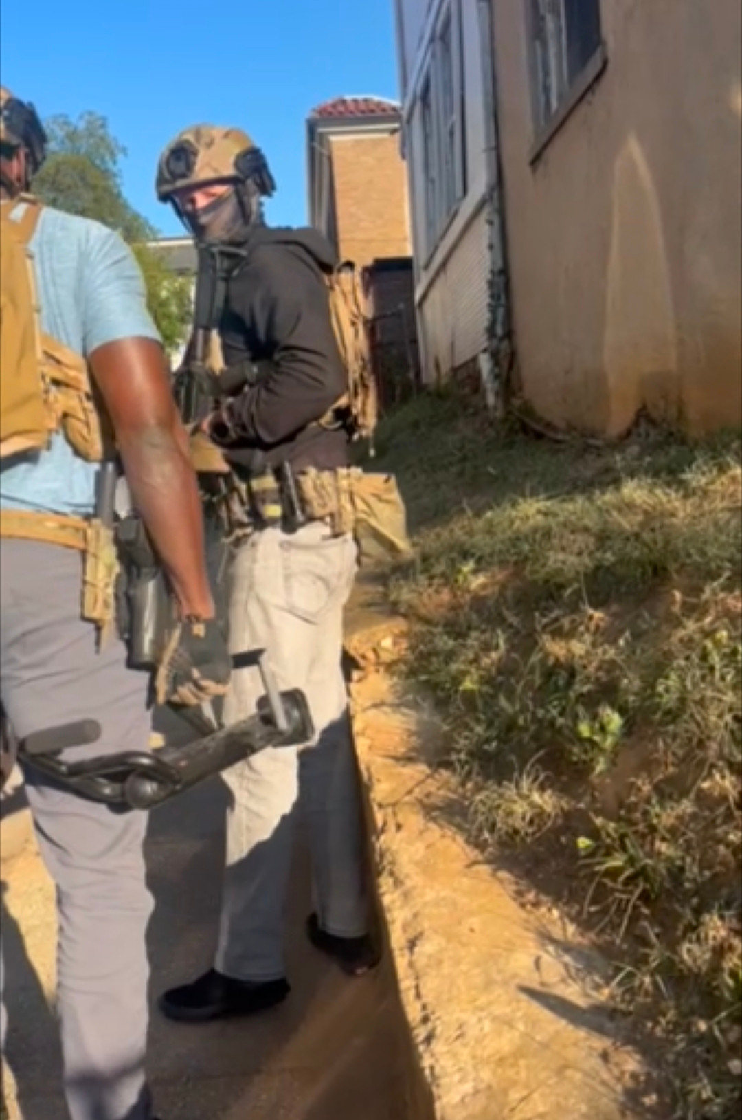 Masked officers in camo