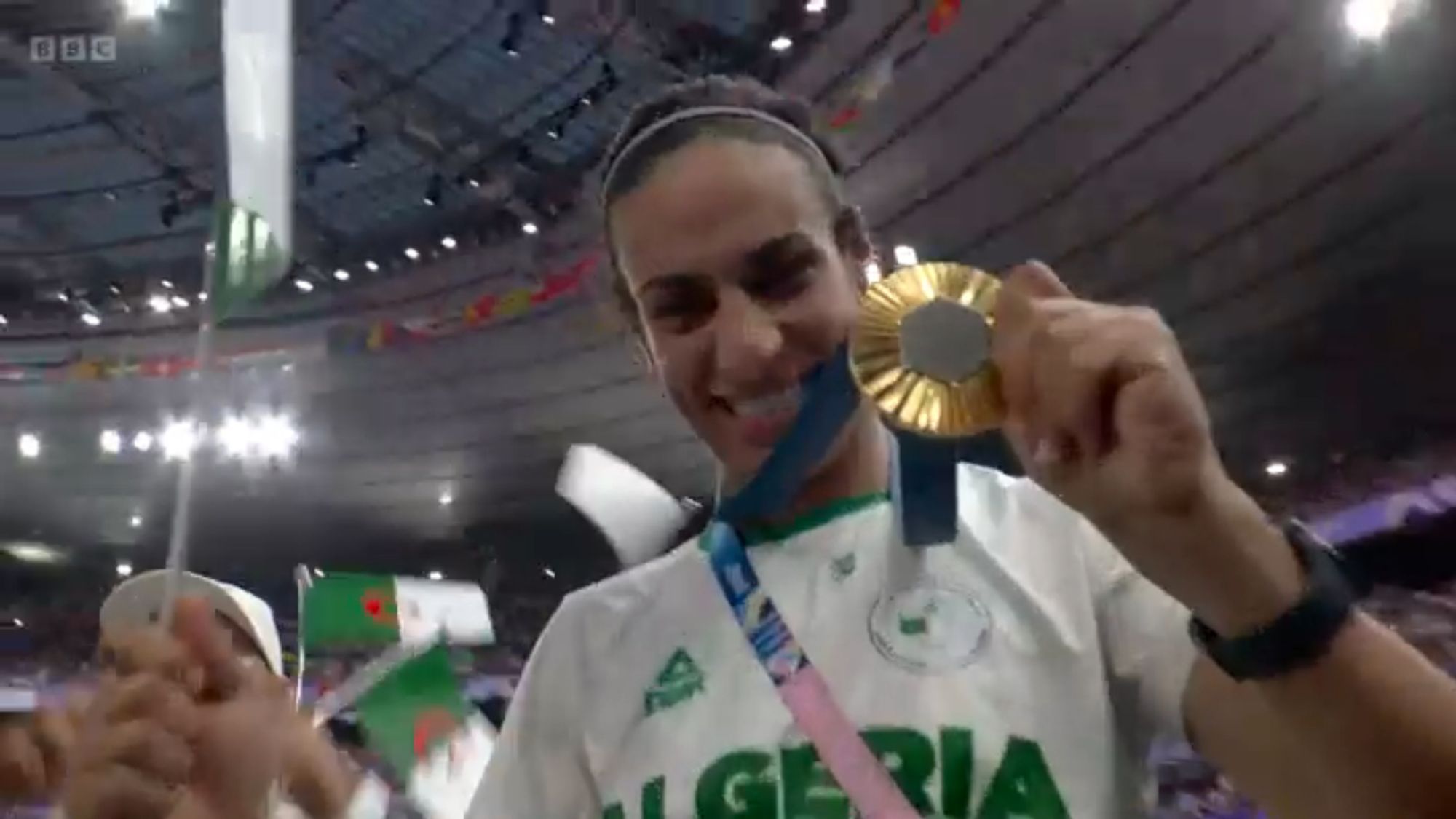 Imane Khelif holding her gold medal during the Paris 2024 closing ceremony.