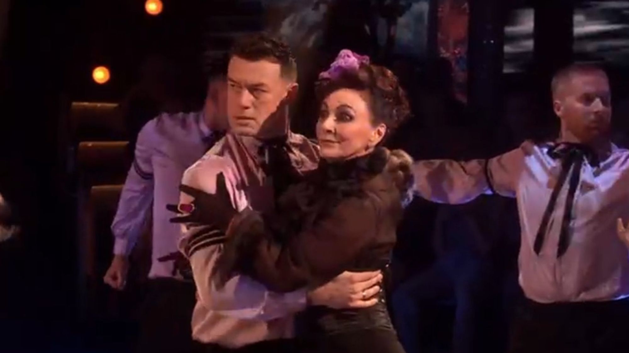 Shirley Ballas protectively clinging to Kai Widdrington.