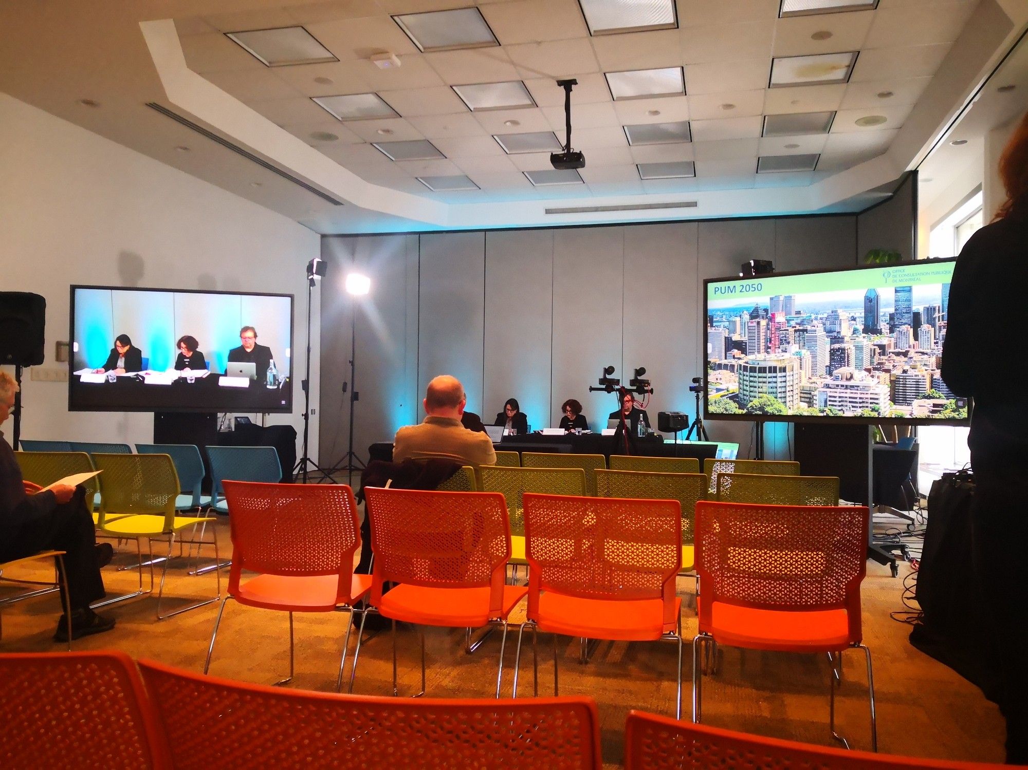 City Consultation set up. Chairs, desk, row of people in charge of the consultation.