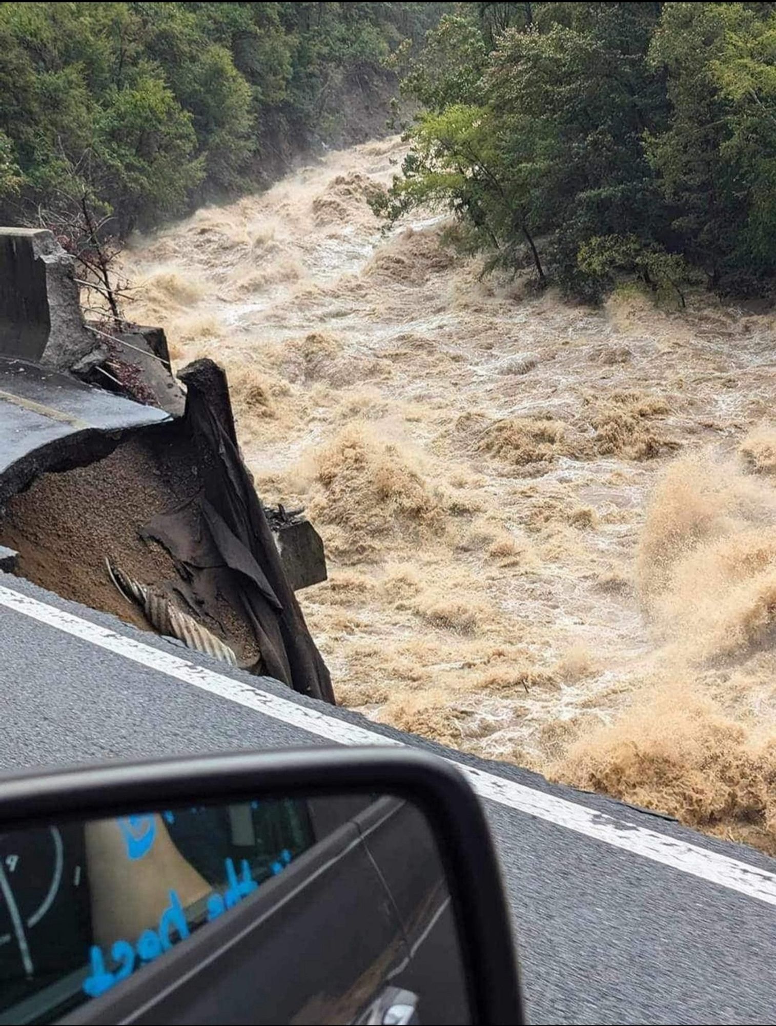 Collapsed highway from flooding.