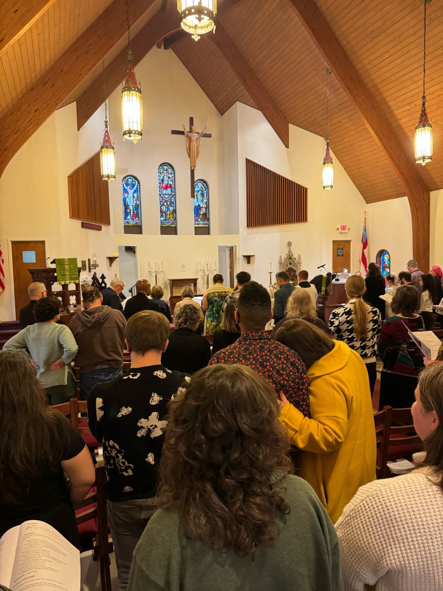 A picture of the congregation gathered; standing during the Proclamation of the Gospel.