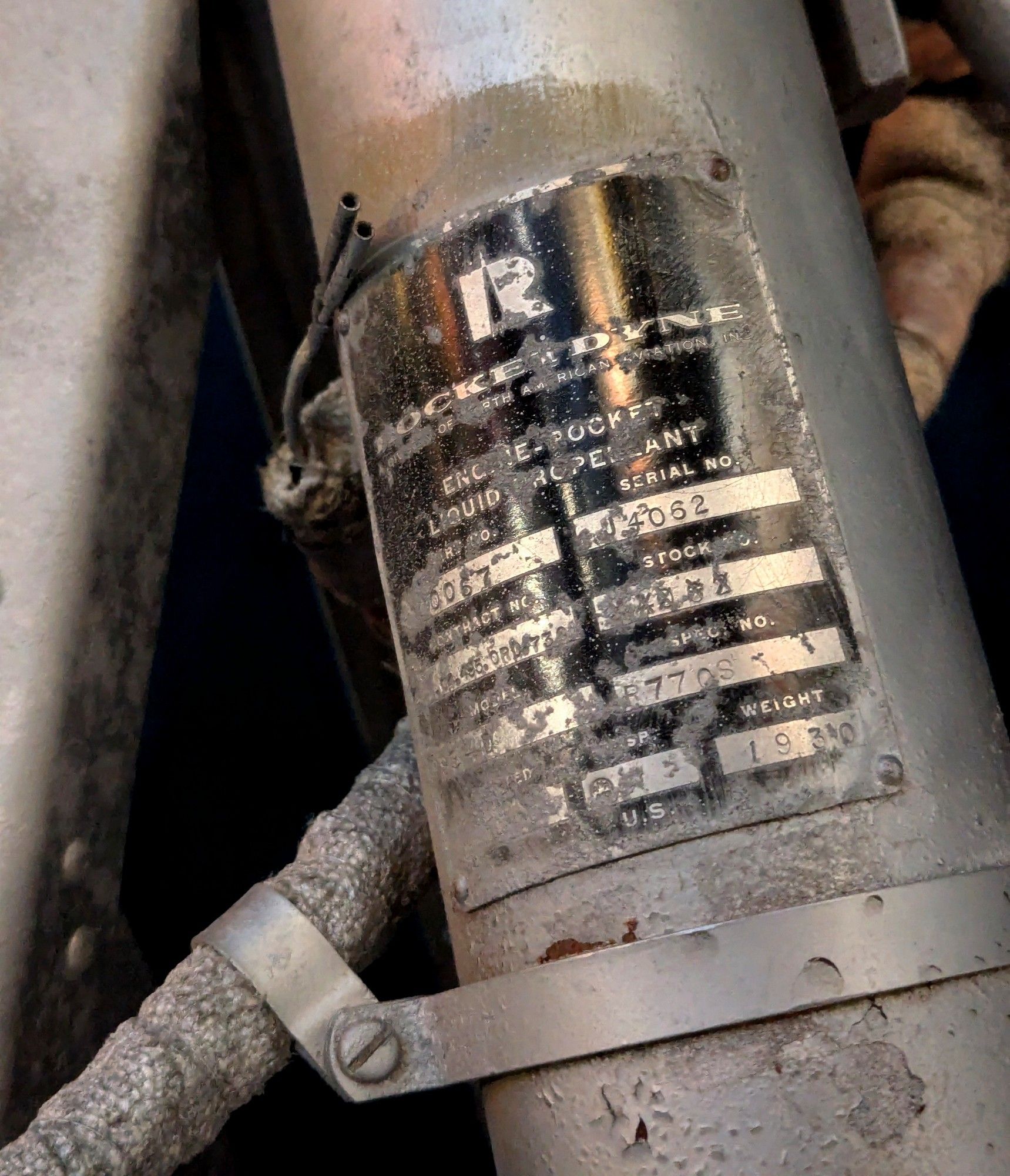 Black Rocketdyne label on a silver colored rocket engine component