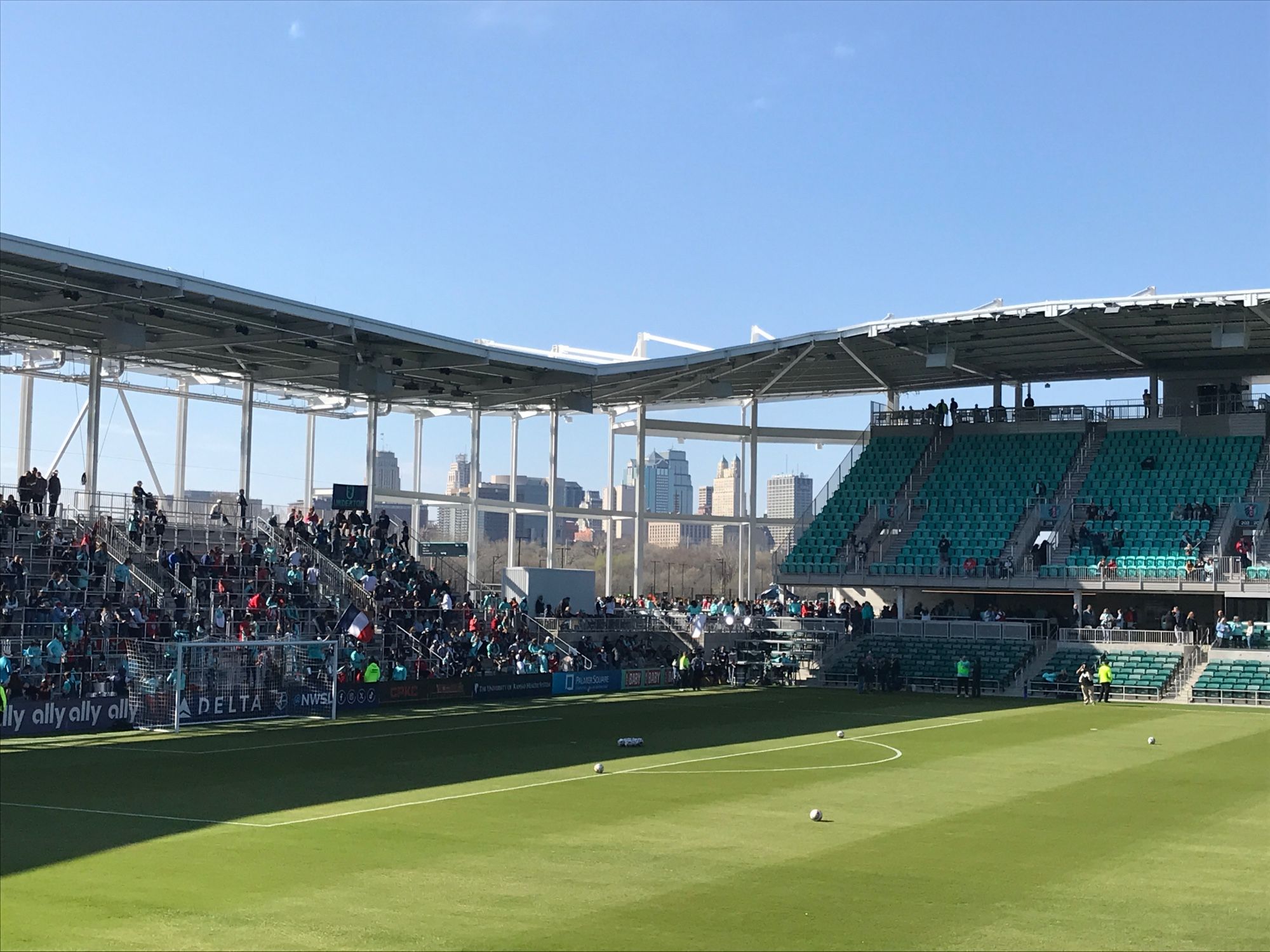 The Kansas City Missouri skyline is framed by CPKC Stadium structural elements in this view looking southwest