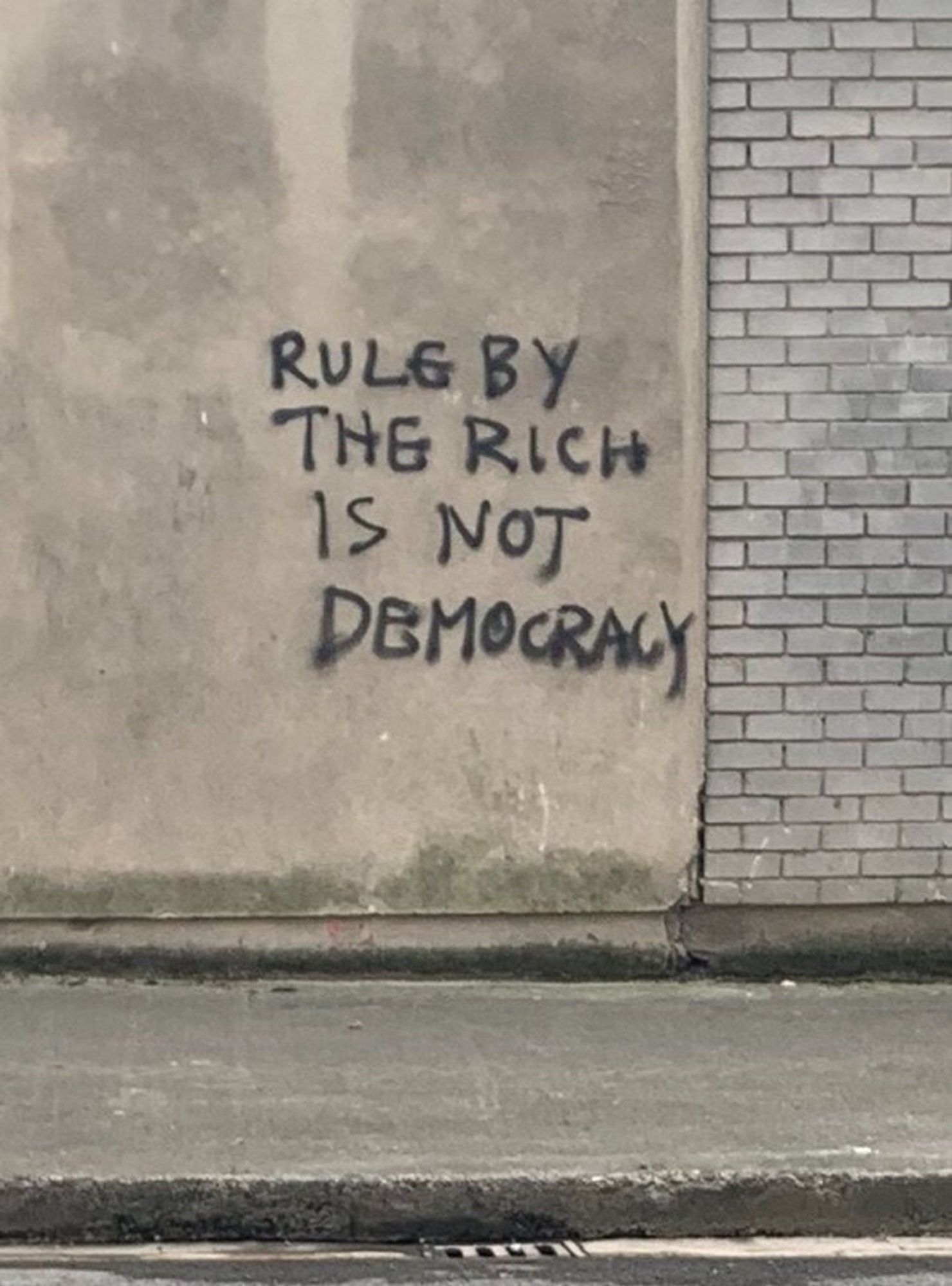 Graffiti:
Rule by the rich is not democracy