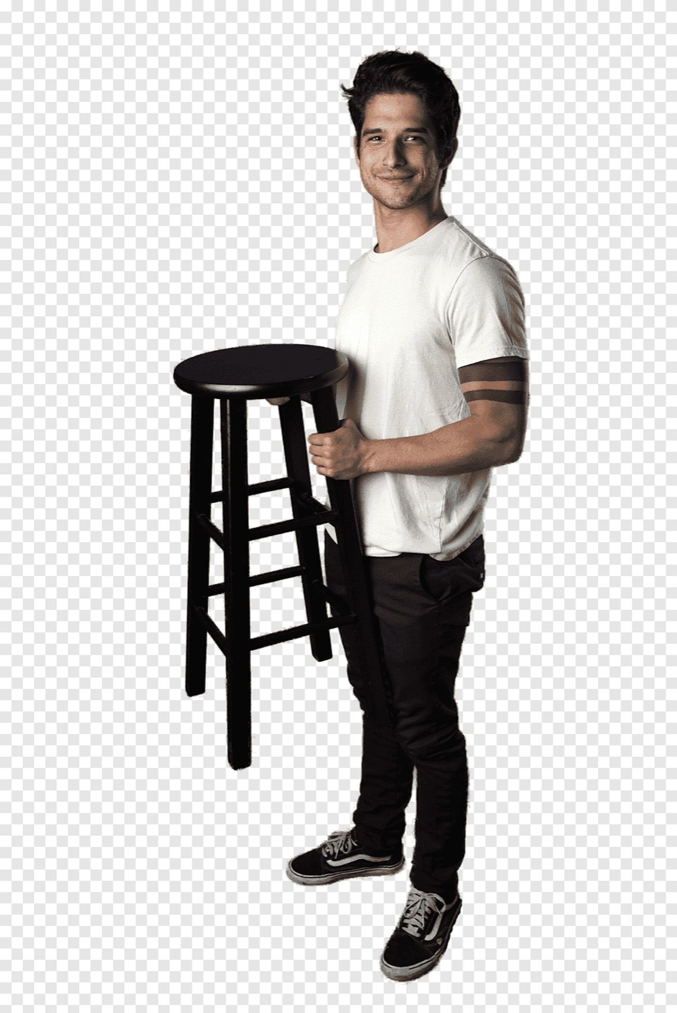 A man holding a stool