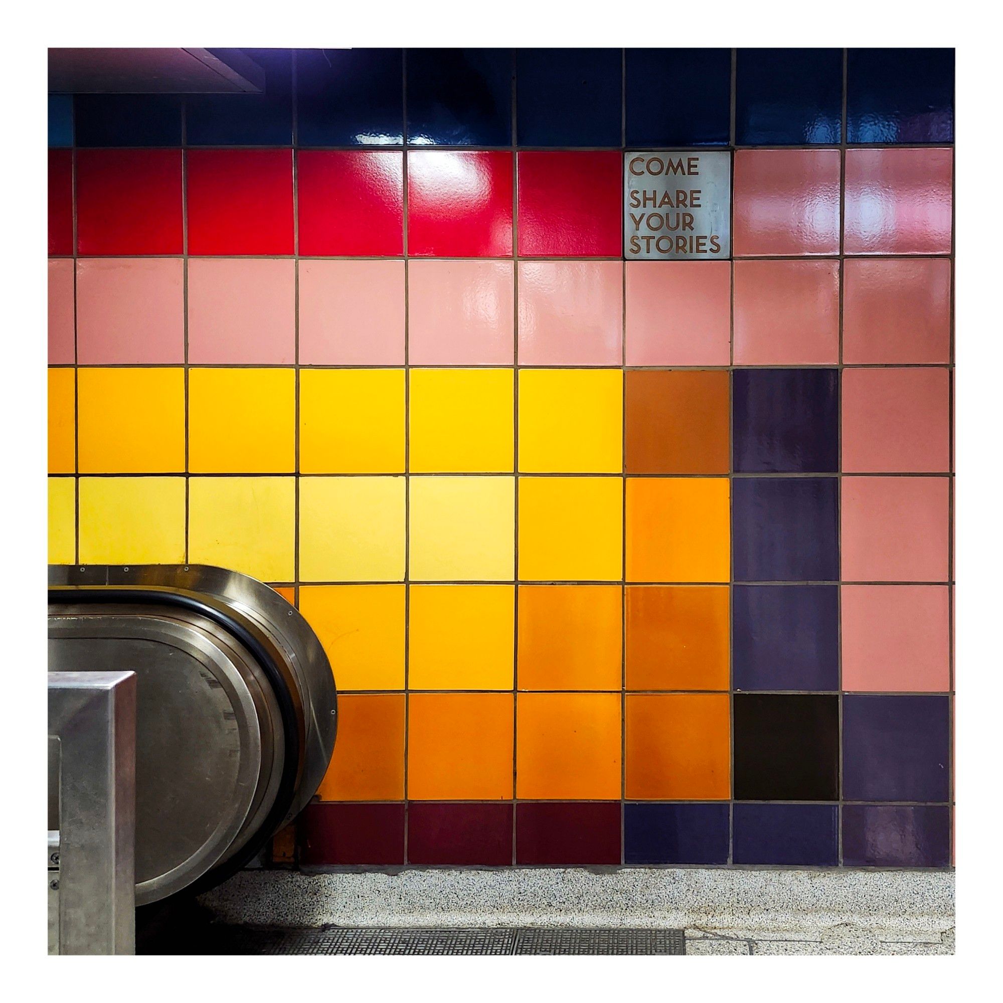 A tile asking riders to share their stories at Dufferin Station in Toronto Ontario