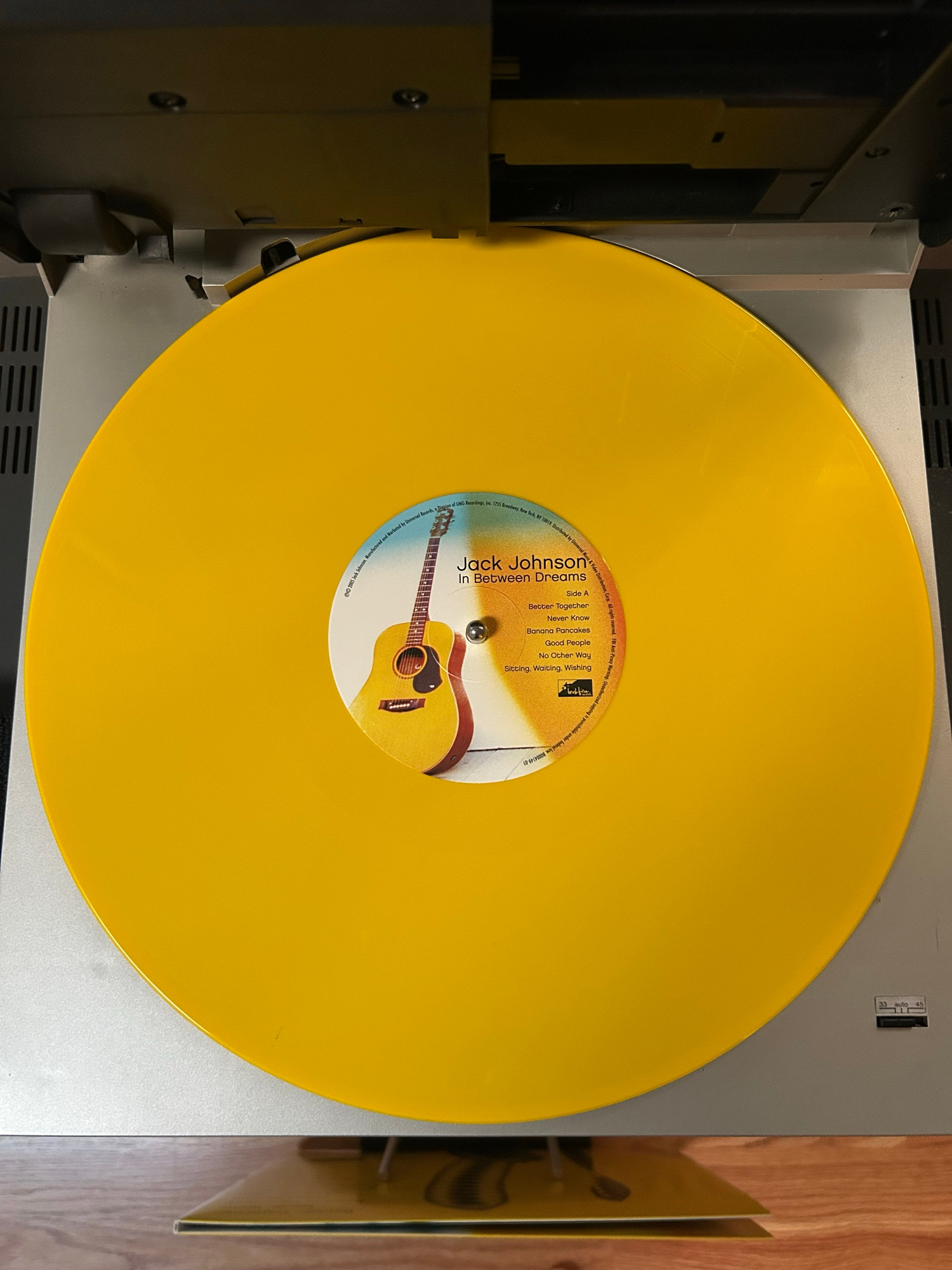 Jack Johnson - In Between Dreams Yellow Vinyl on turntable 