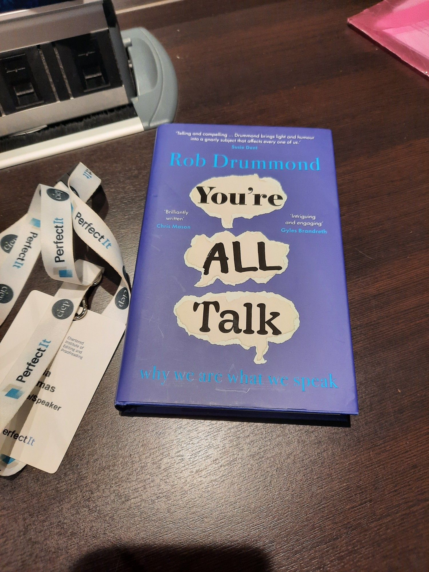 You're All Talk by Rob Drummond, on a table next to a CIEP conference badge and lanyard