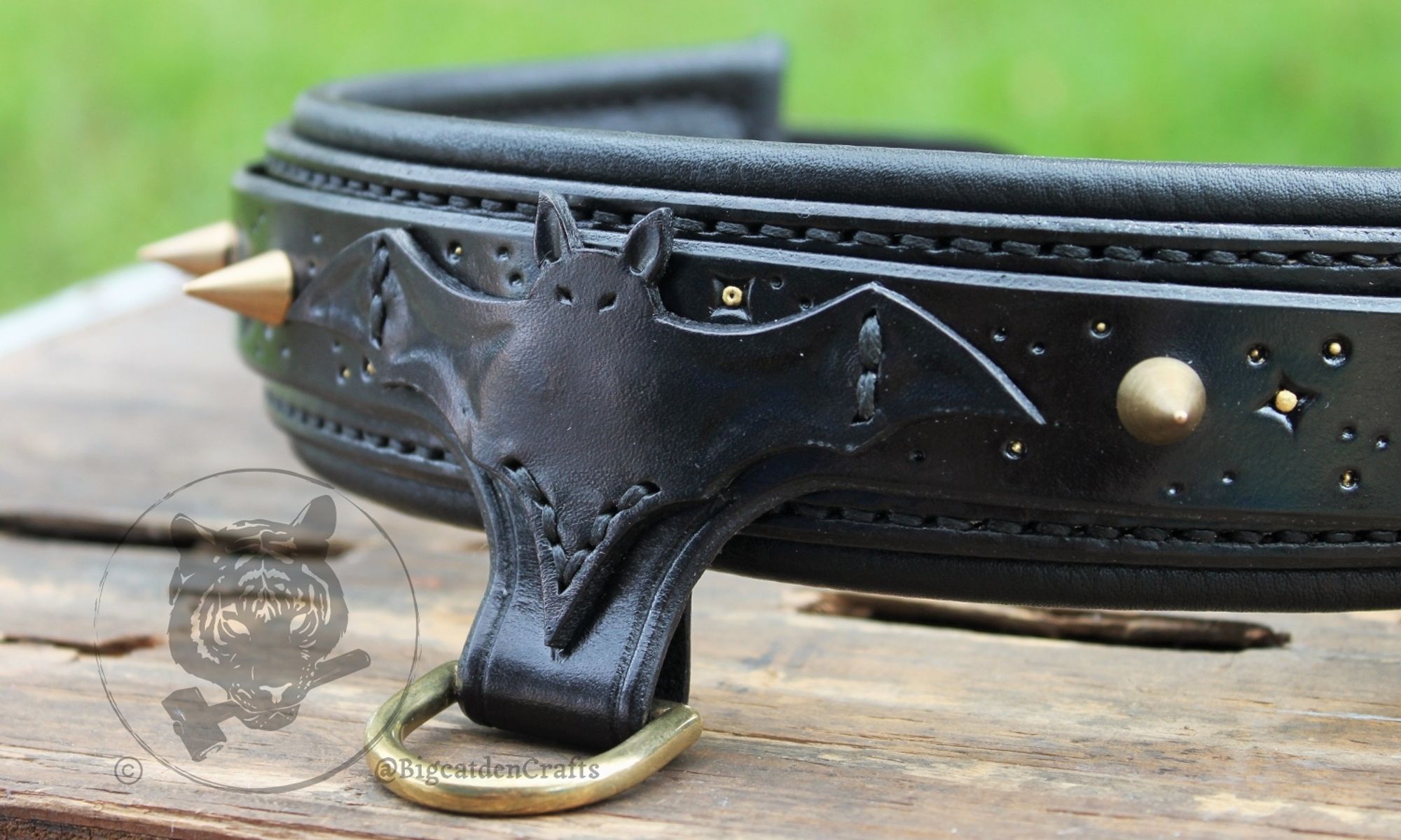 Close up on the front of the collar showing off the tooled bat silhouette emblem sewn onto the front of the piece.