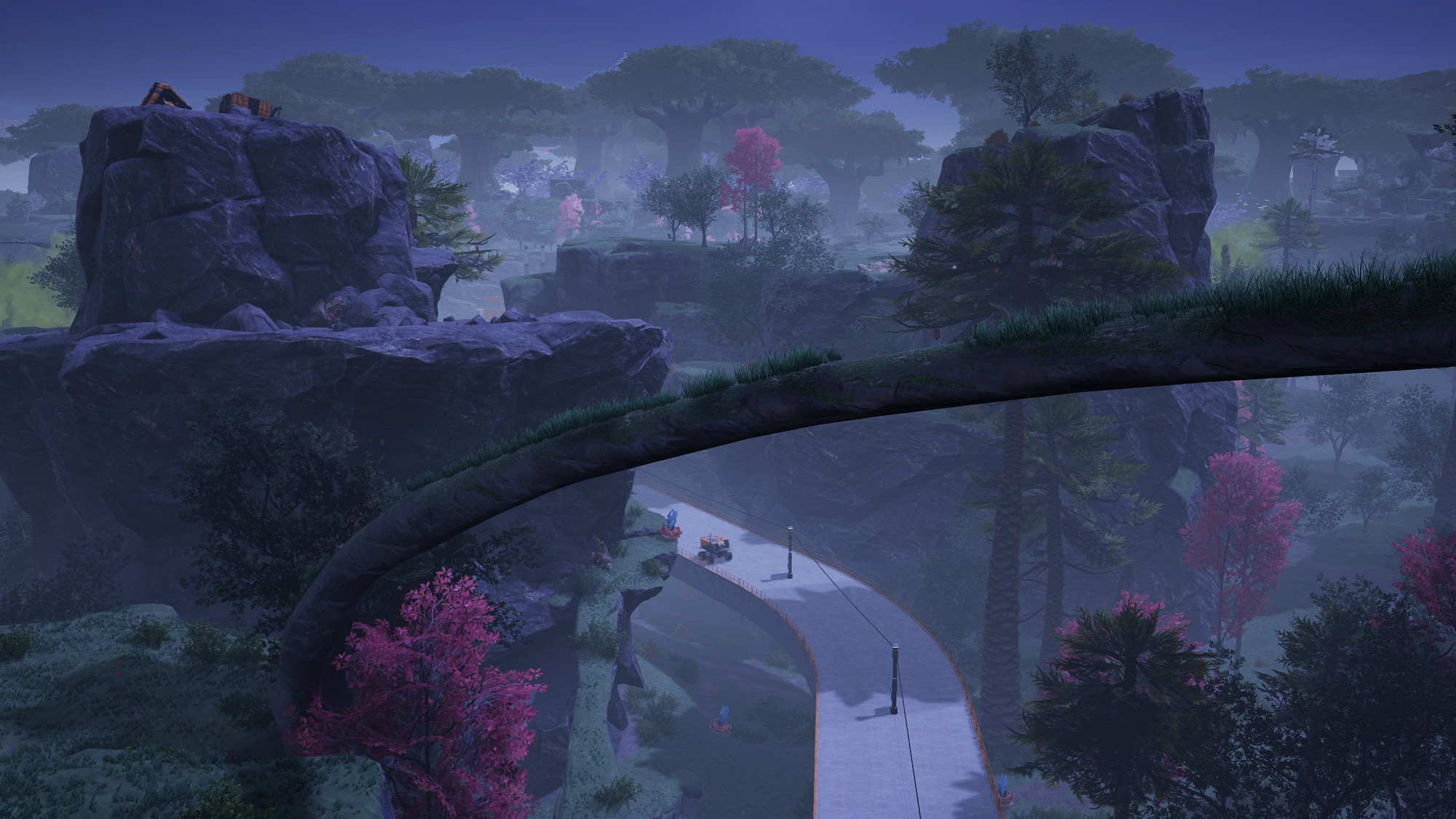 A screenshot from the game Satisfactory. It is night time, there is an elevated, concrete roadway snaking through a valley with power poles along the centre median and safety railings on the outer edges. In the medium distance, a small automatous cargo tractor is driving away from the camera.  