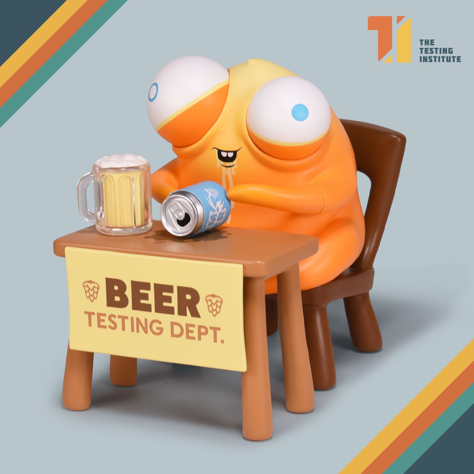 Picture of yellow bug-eyed creature sitting with mug of beer and can, toy by Andrew Bell