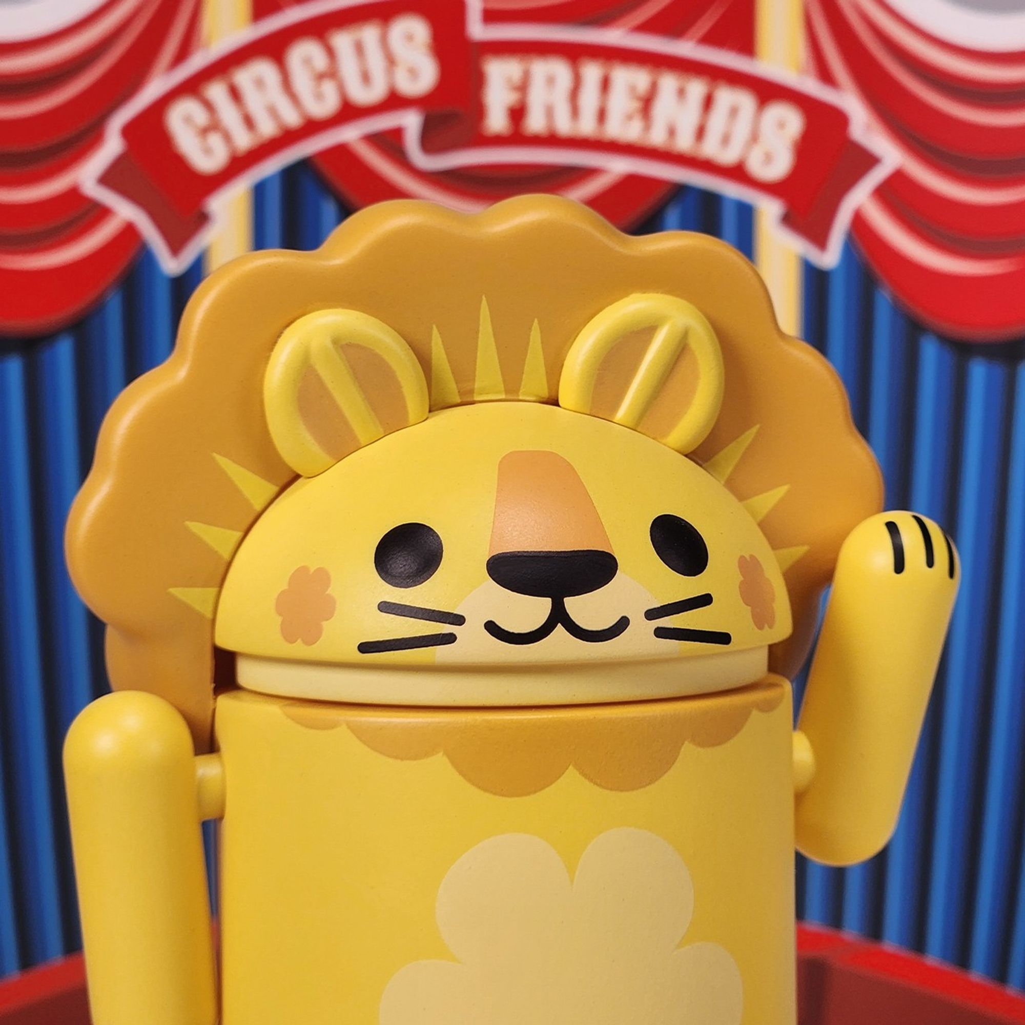 Lion Android figure with big mane waving paw in the air