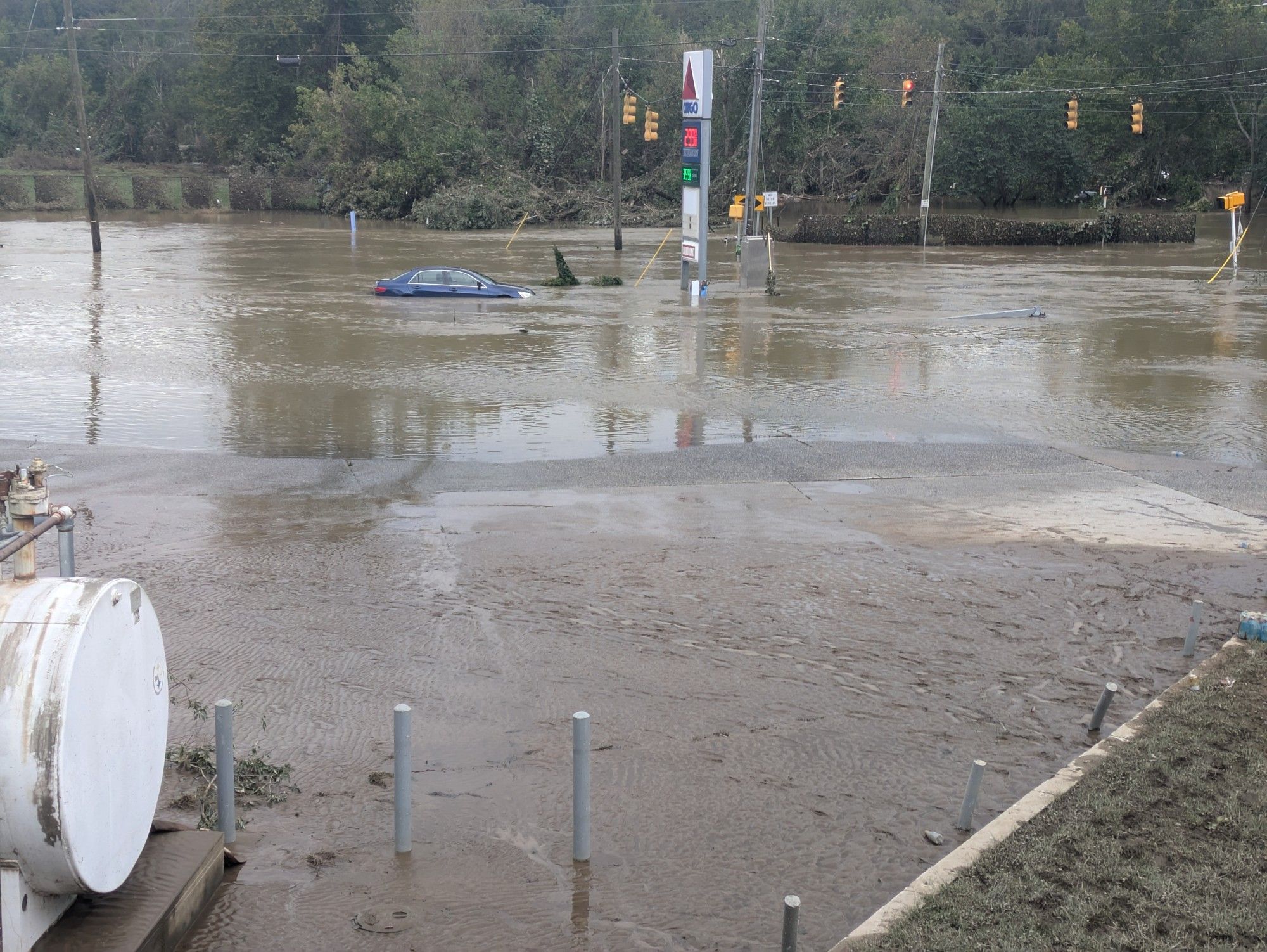 Car and road submerged under water