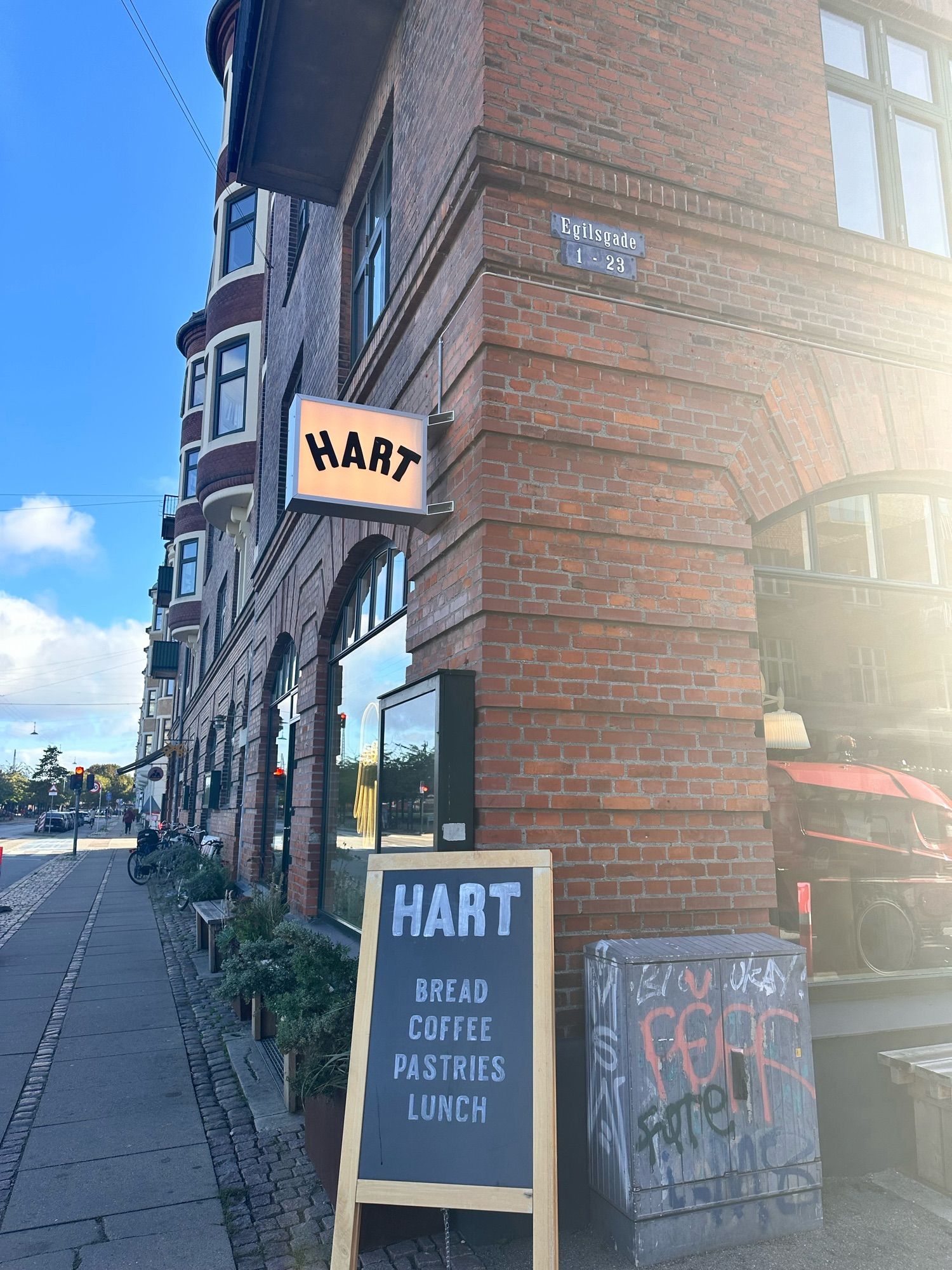 Outside one of the Hart Bageri locations, a red brick building with a sign that says “Hart”