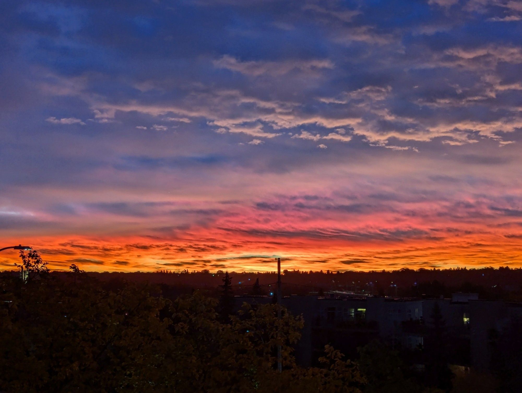 Colourful sunrise with blues and oranges and pinks.