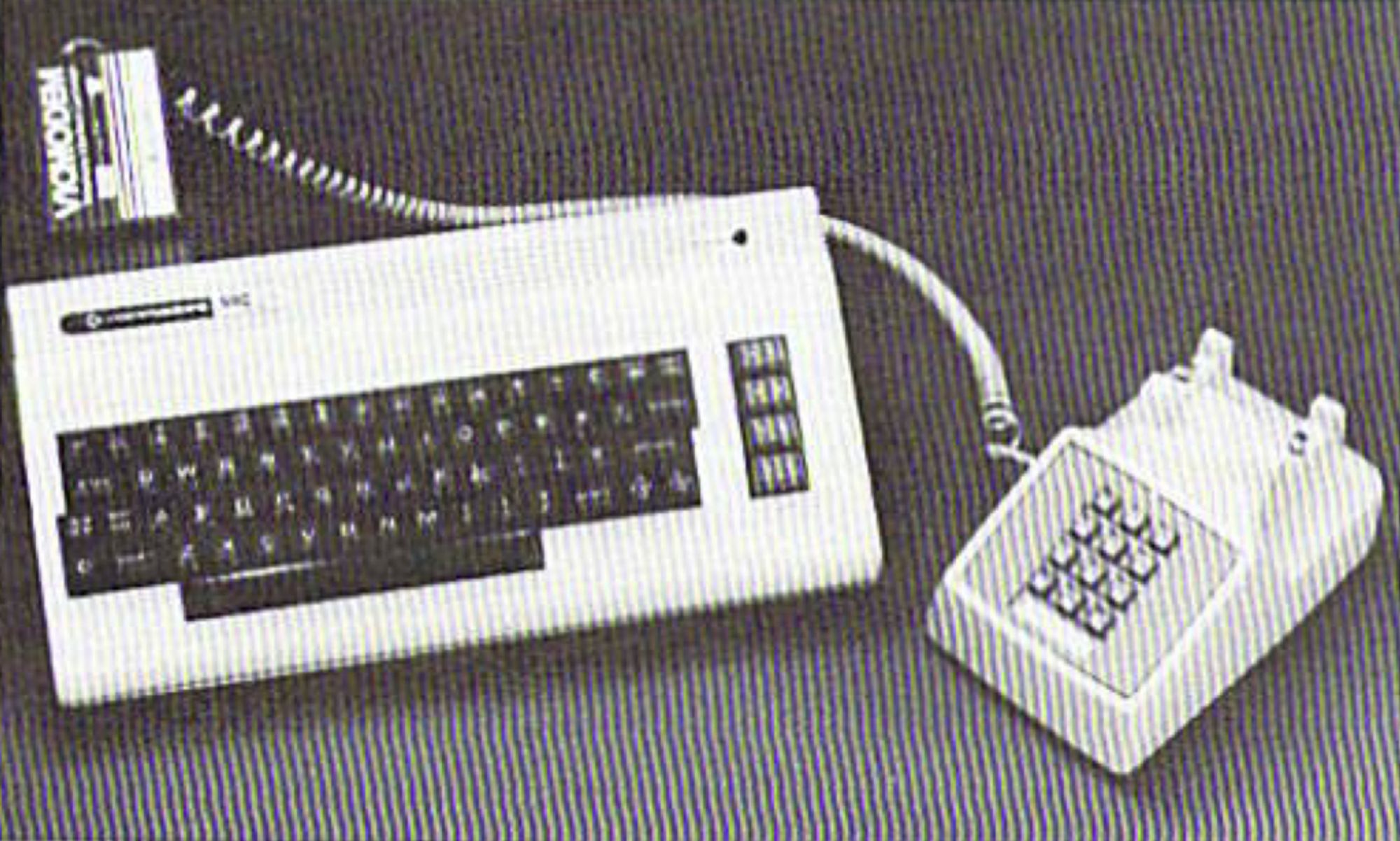 The Commodor VIC20 with VicModem and a corded telephone.