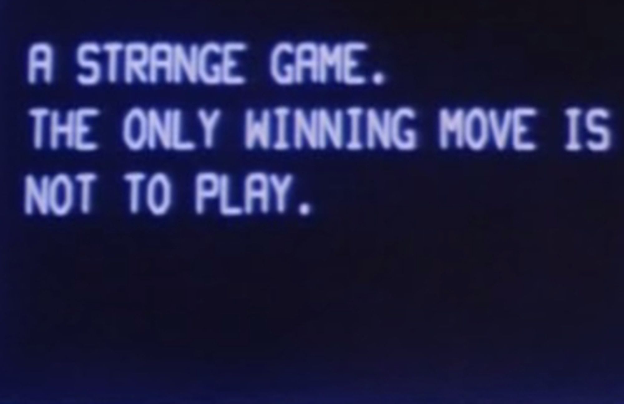 Screenshot from Wargames, when WOPR says, "A strange game. The only winning move is not to play."