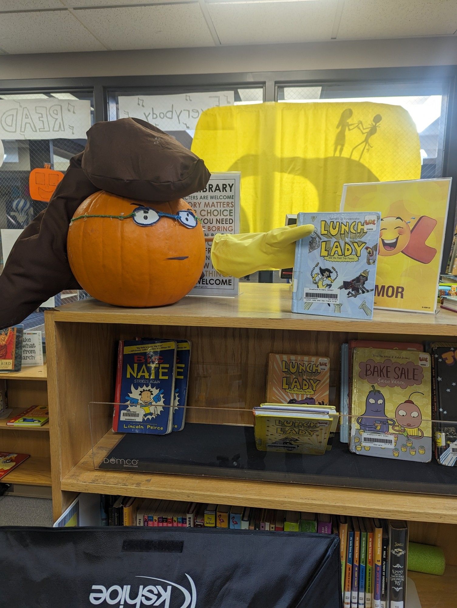 A pumpkin decorated to look like the book character Lunch Lady.