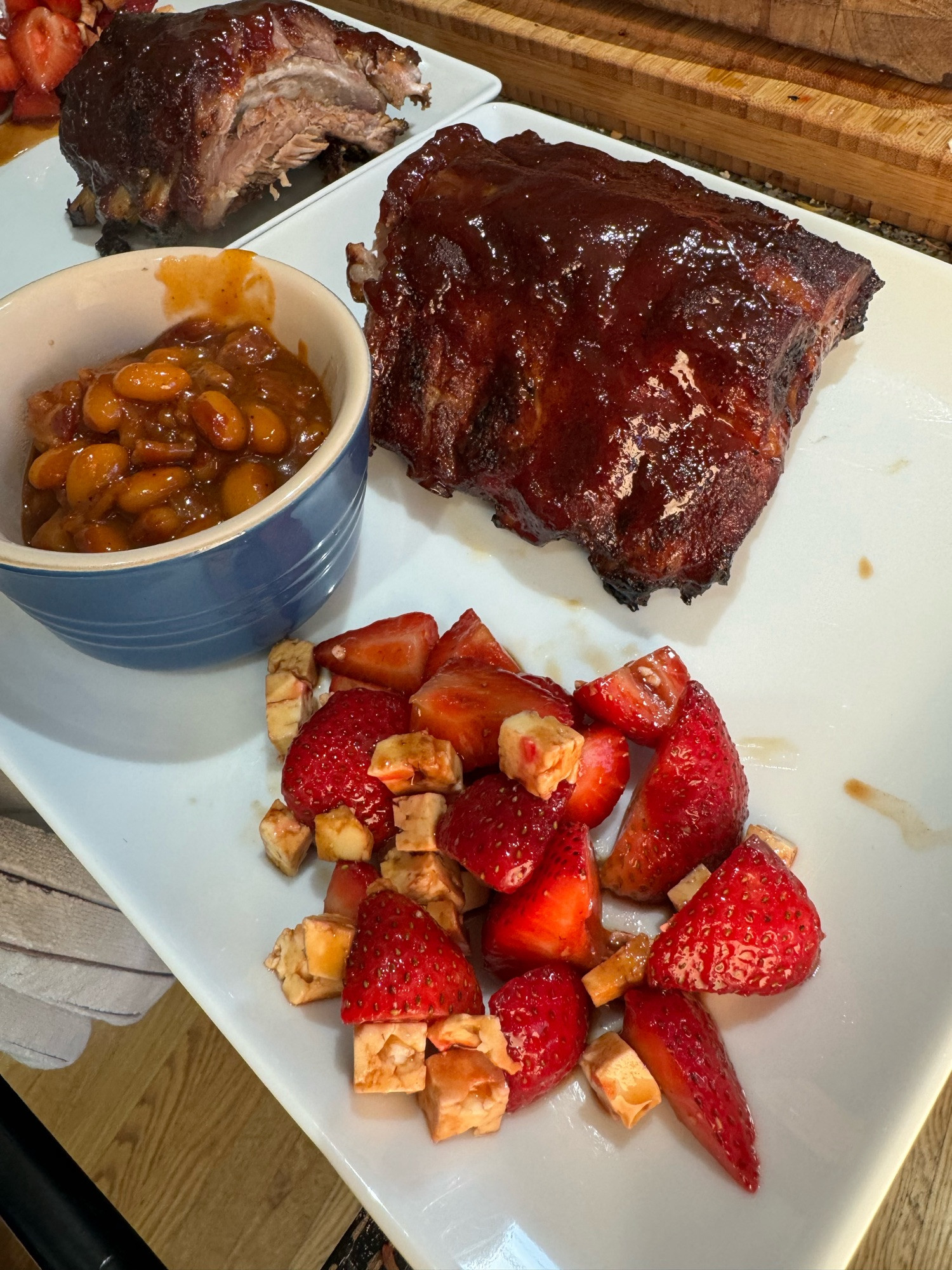 Honey bourbon glazed smoked pork ribs Strawberry feta balsamic salad and yellow eyes baked beans