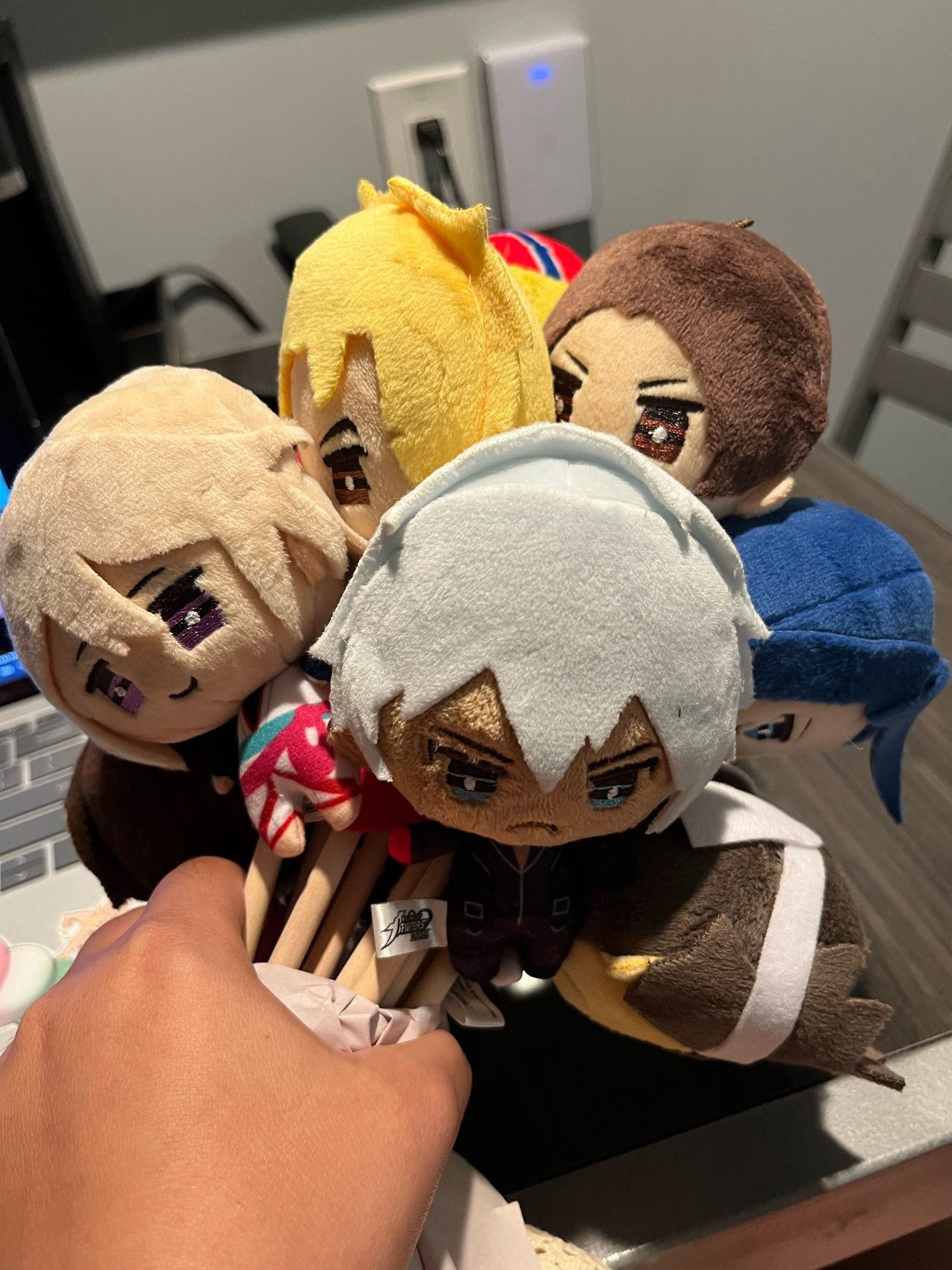 a bundle of small kof keychain plushies.