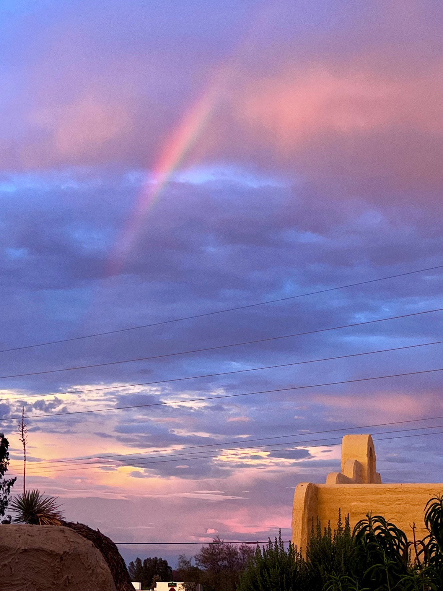 Rainbow in a colorful cloudy sky 
