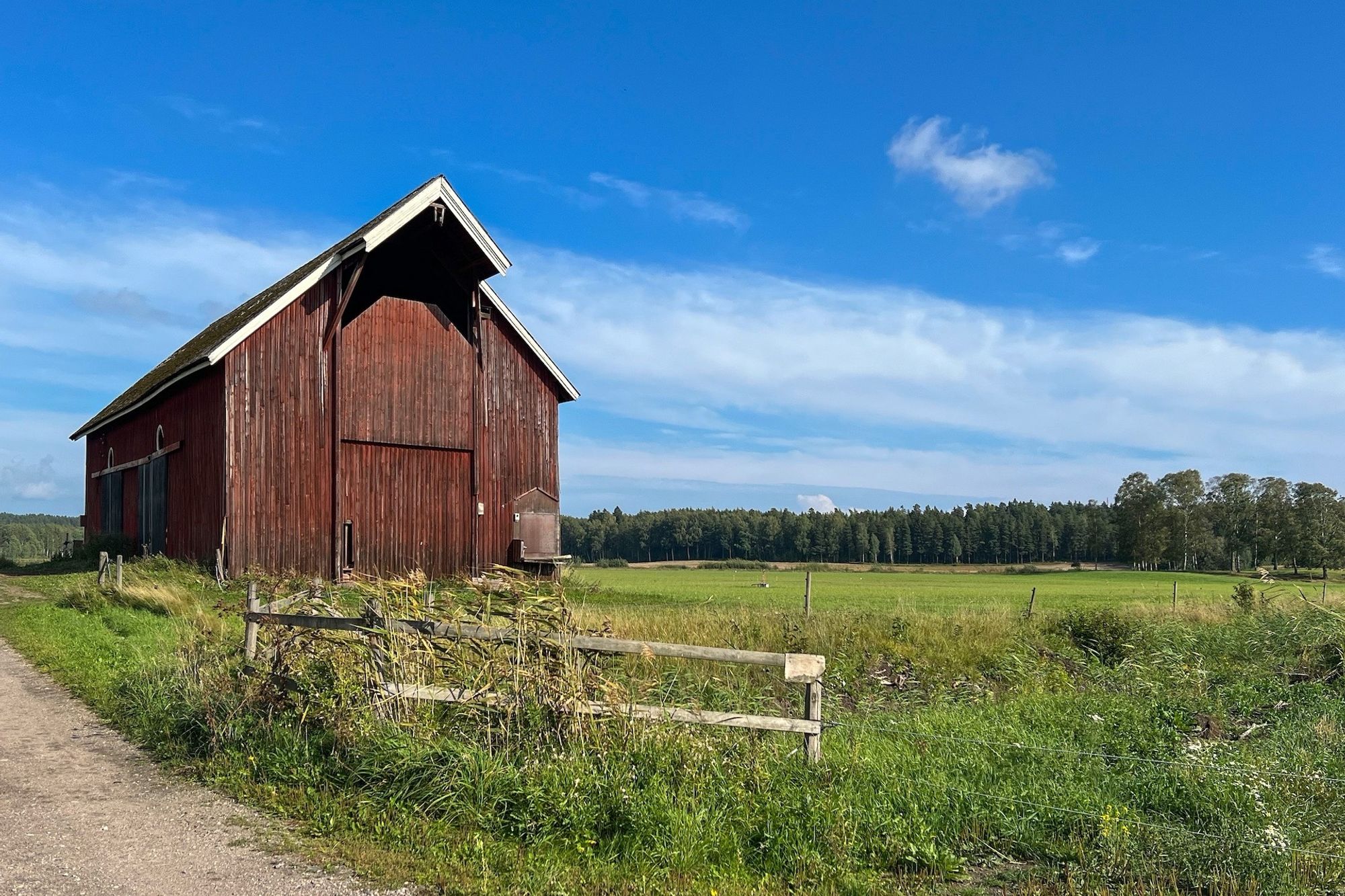 Red barn under September skies.