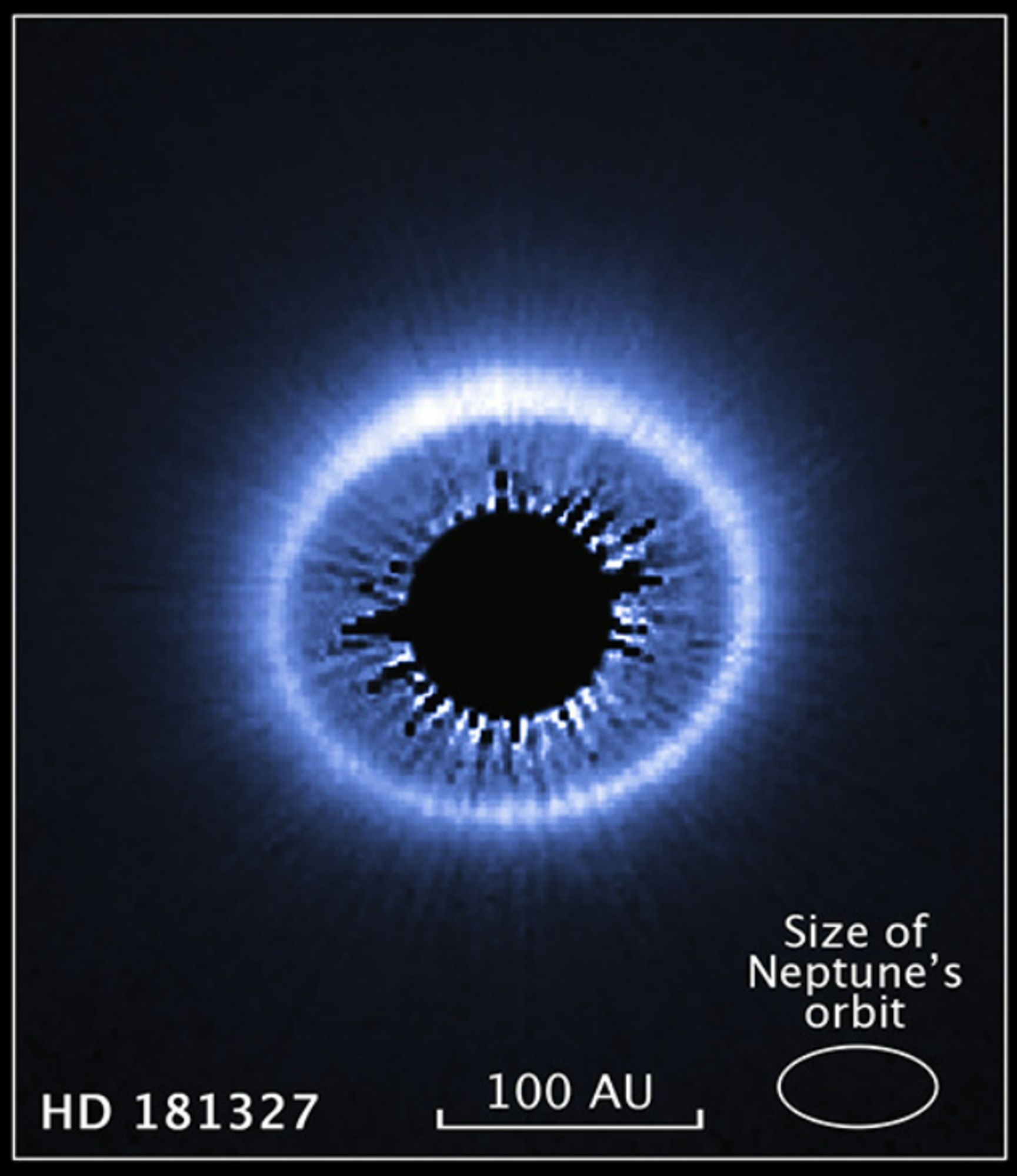 NASA Hubble image. Title: "Debris Disk Around Nearby Star". Image resembles human eye with iris and pupil.