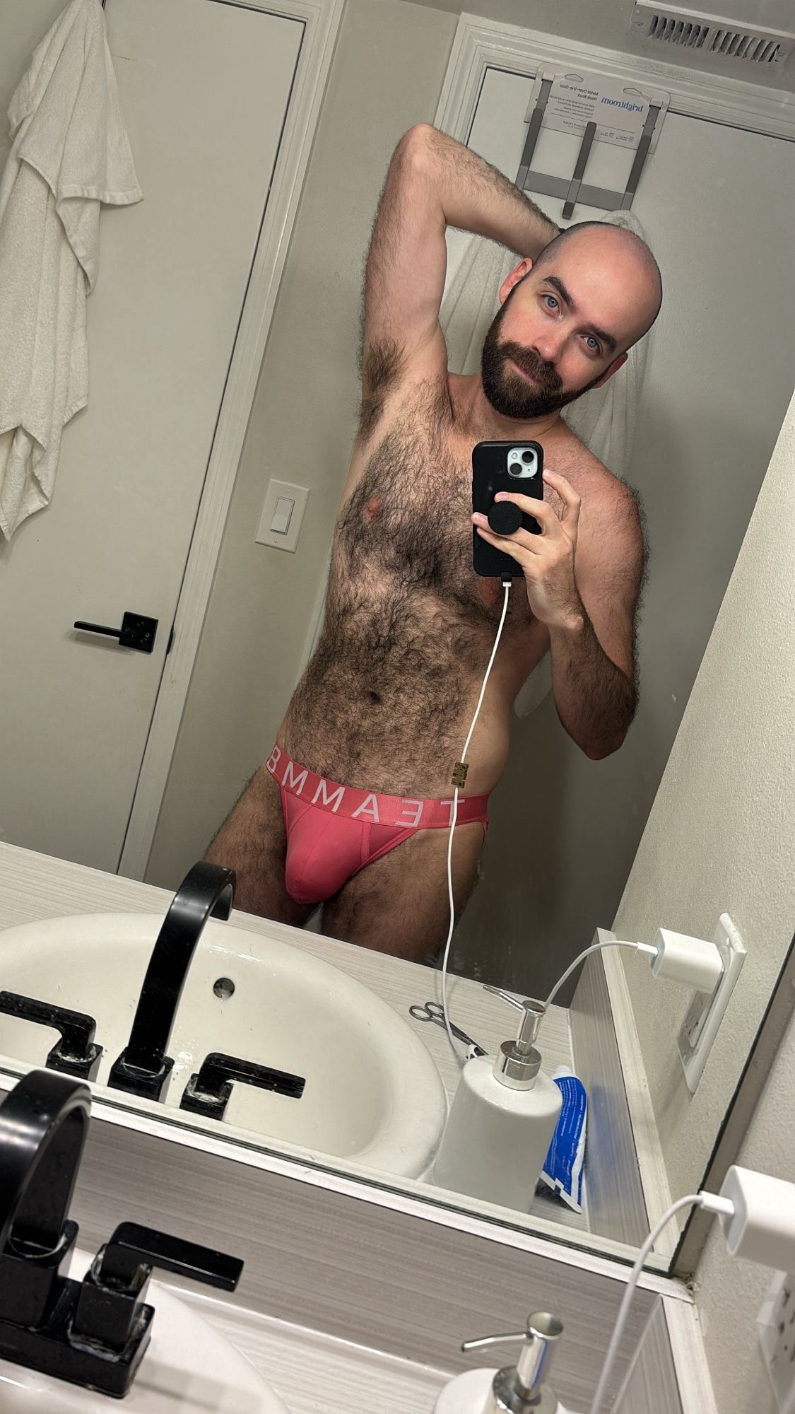 Scruffy otter boy in a pair of pink bikini briefs