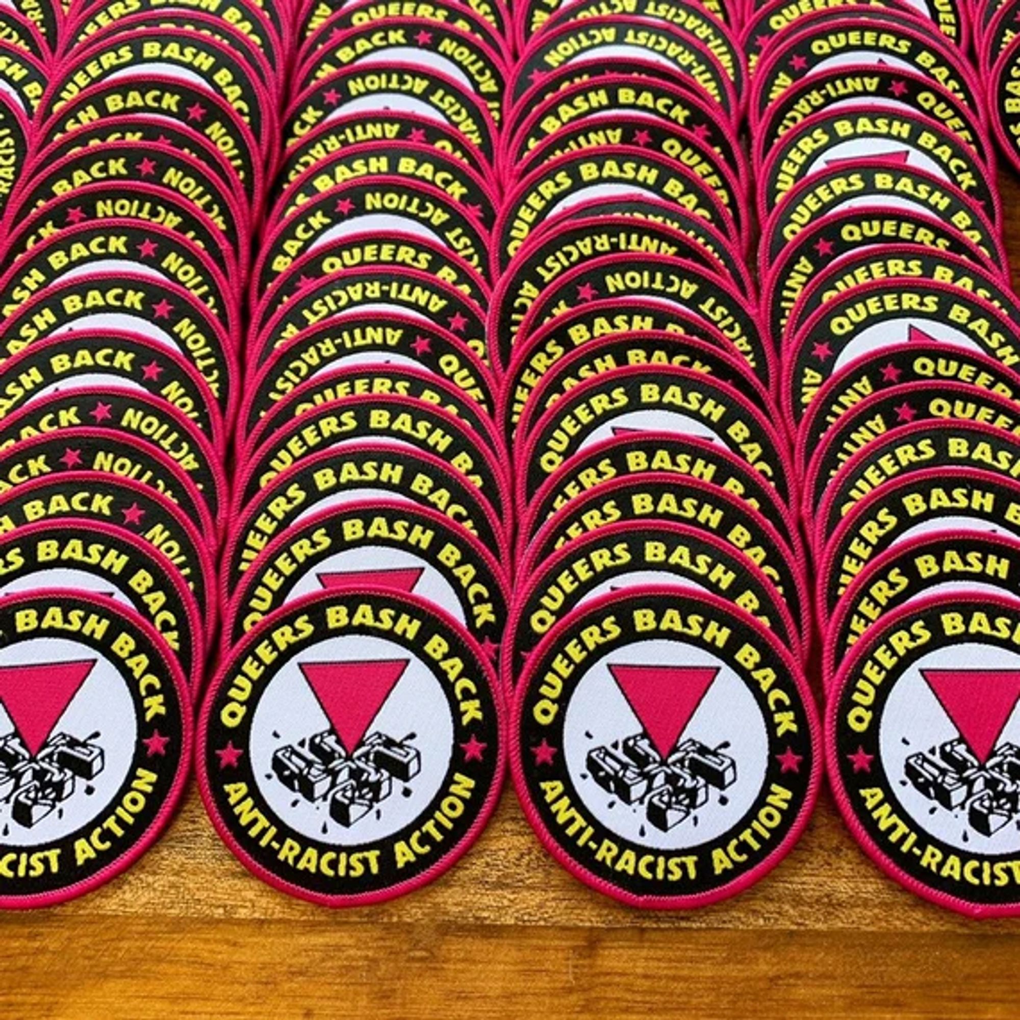 mass produced pink "queers bash back" anti-racist action patch