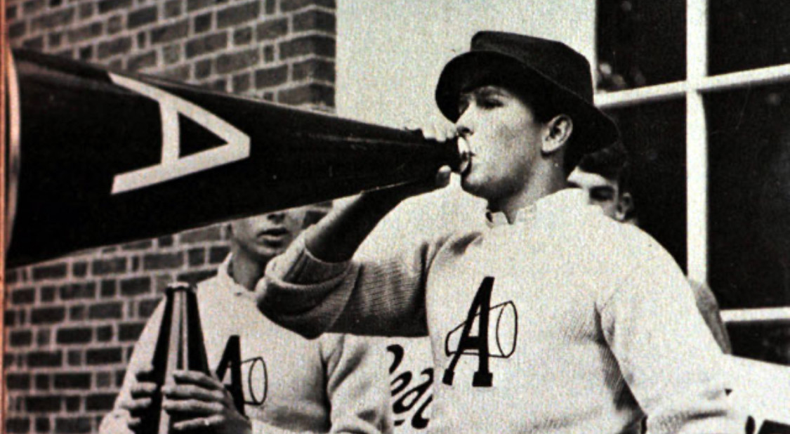 Young George W Bush leading a cheer at Andover