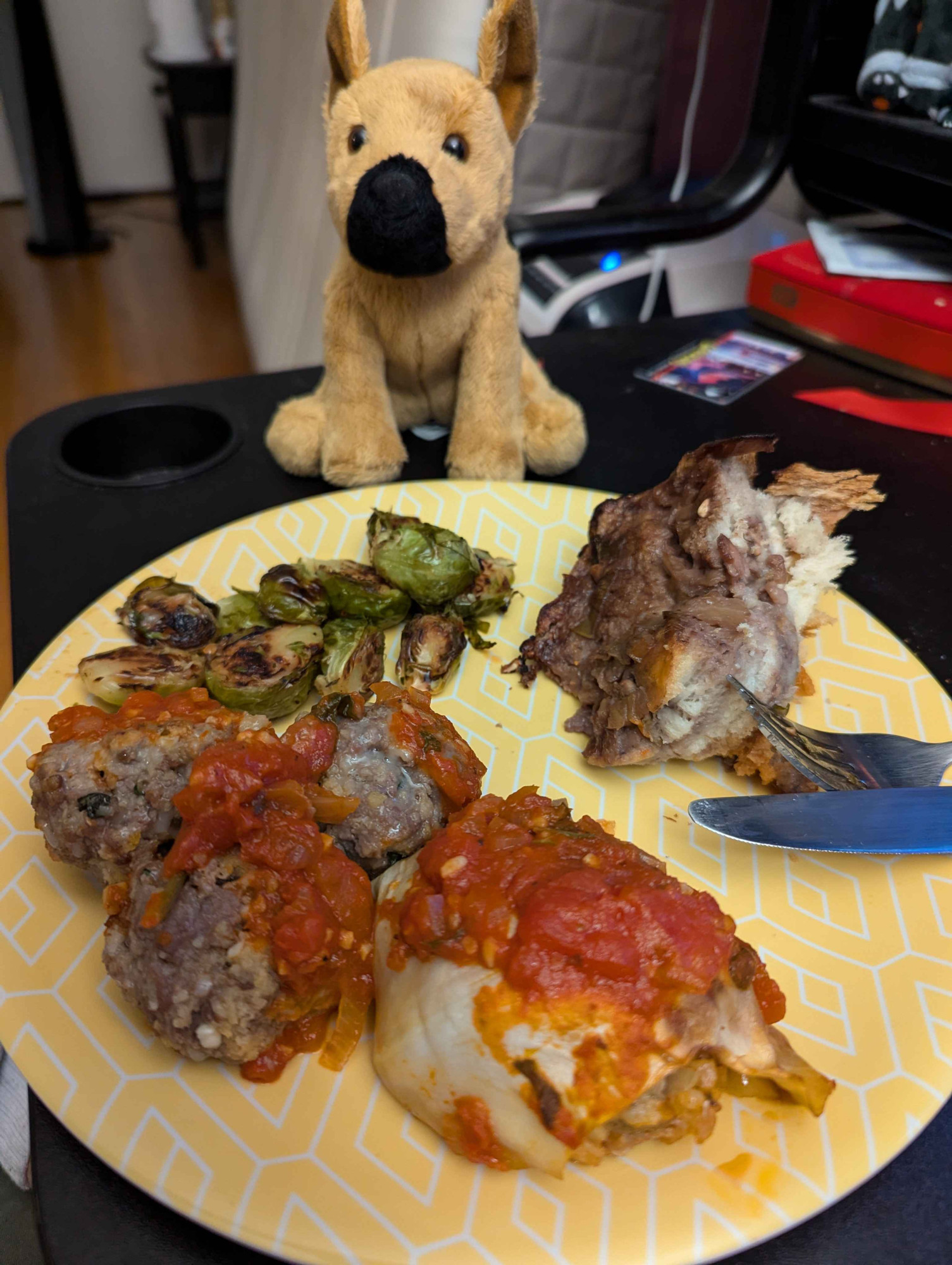 Meatballs, cabbage roll, roasted Brussels sprouts, bread pudding