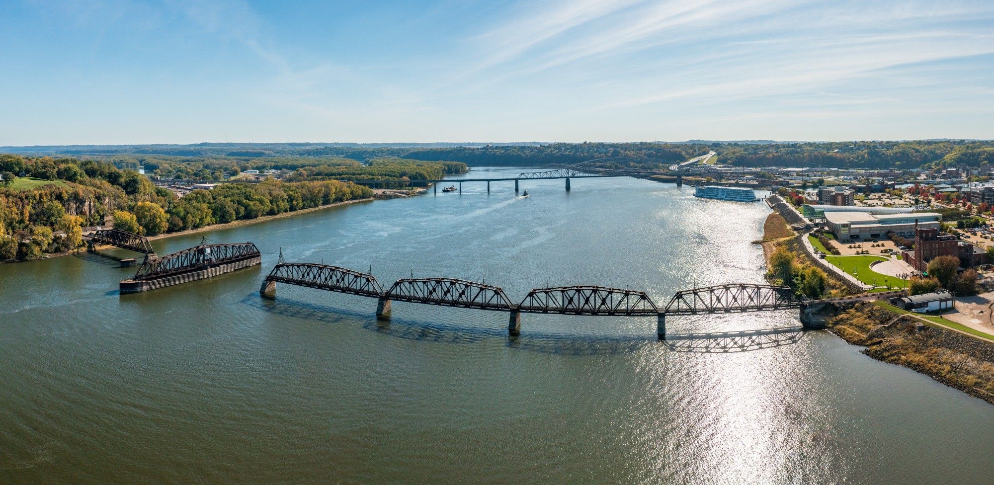 An aerial shot of the large Mississippi River (US) with two bridges crossing the murky, wide river