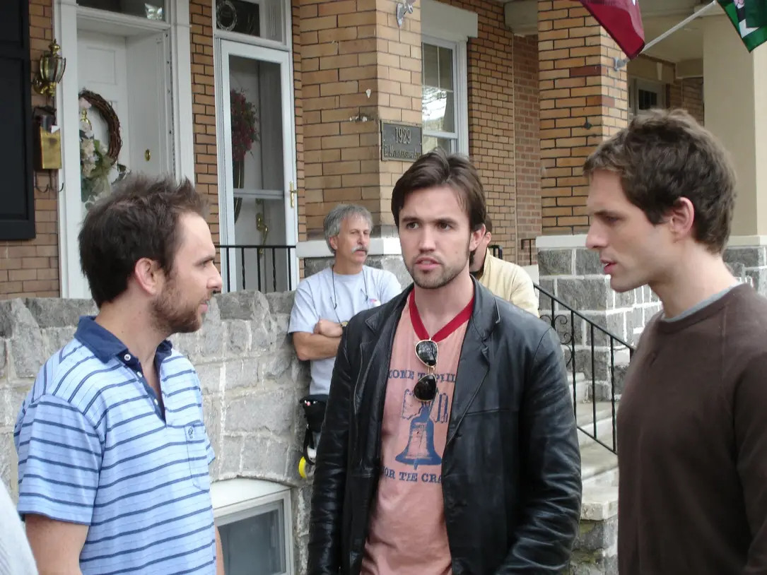 Three main men on always sunny looking young by a house