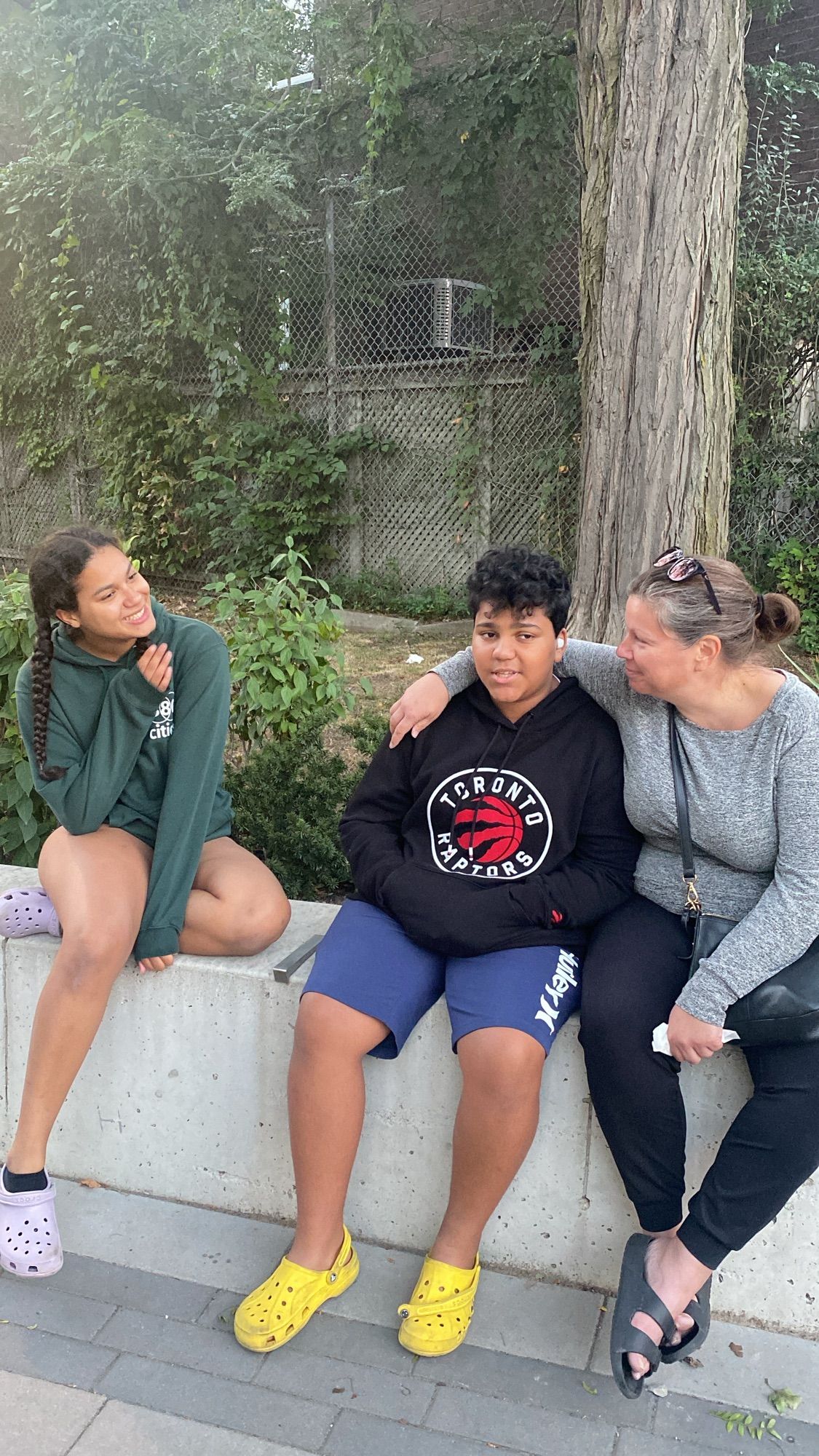 Three people Hanging out at a park