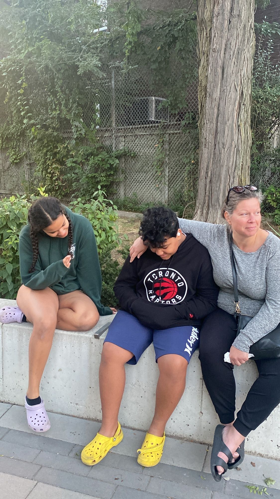 Three people Hanging out at a park