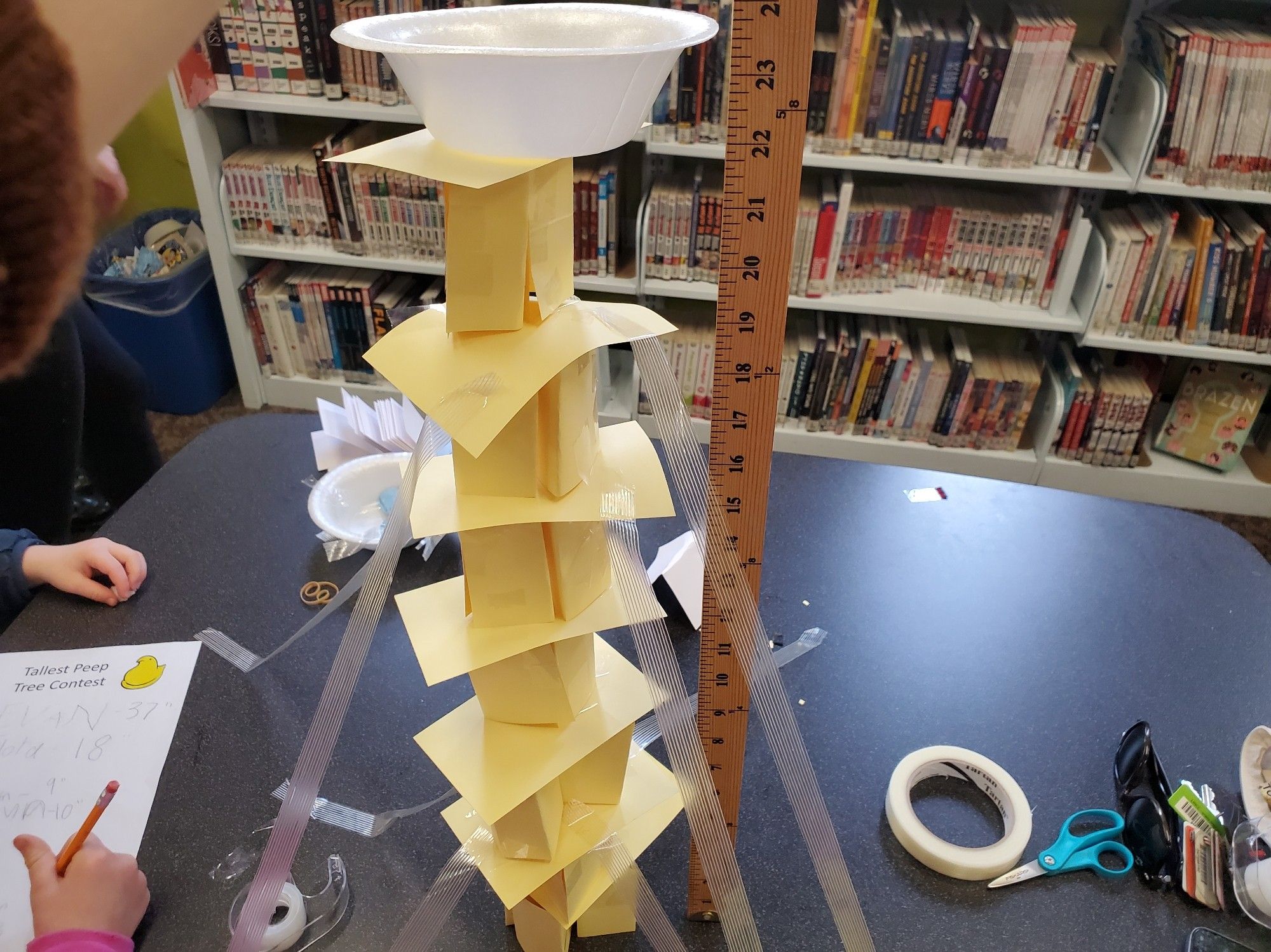 Photo: A peep in a plastic bowl nest rests atop an index card tower measuring 23.50 inches.