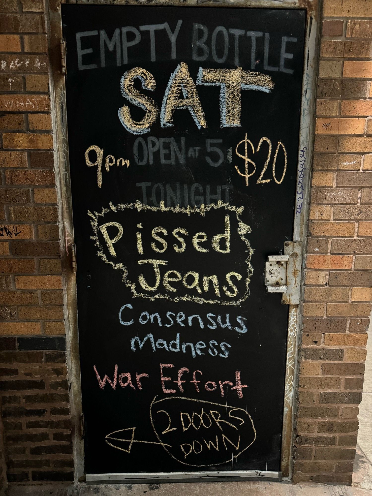 Chalkboard door at Empty Bottle listing the bands for the nigh: PISSED JEANS, consensus madness, and war effort.