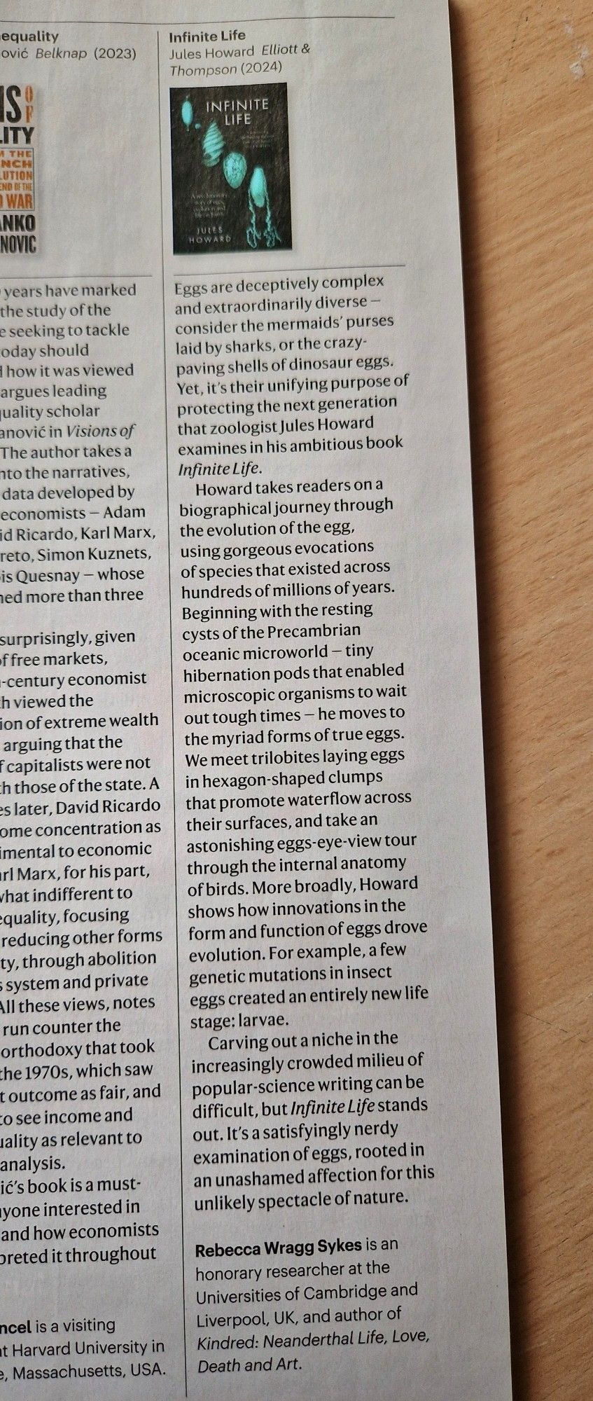 Photograph of book review of INFINITE LIFE, written by Rebecca Wragg Sykes, in Nature's science summer reading list