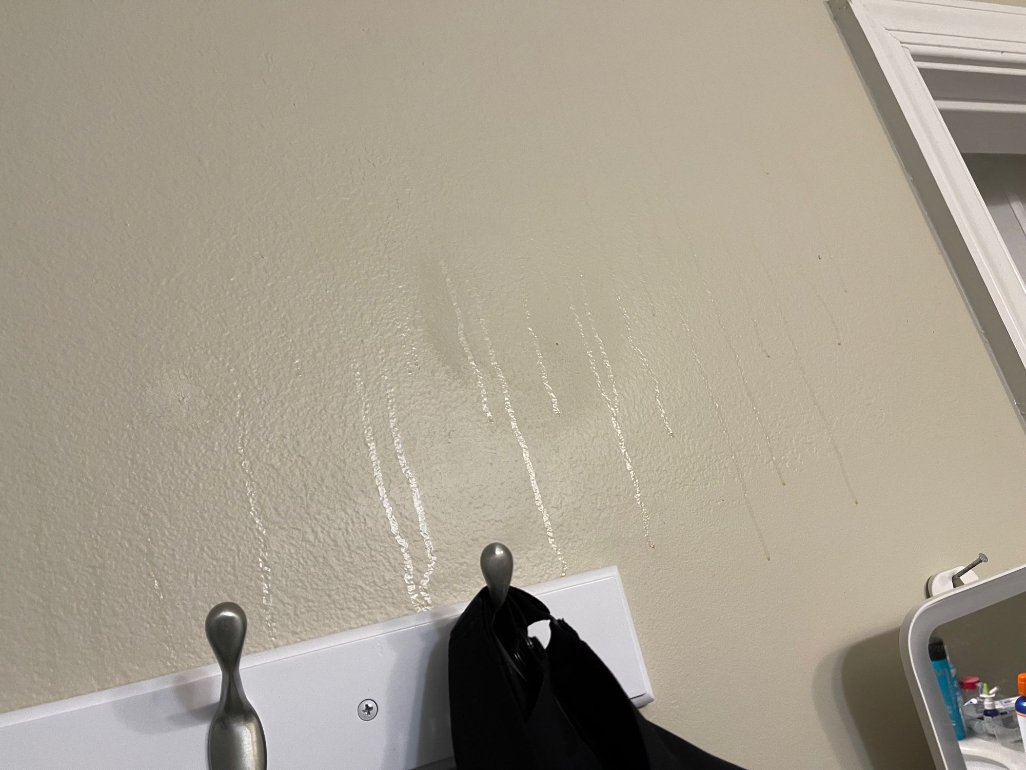 Transparent drips on painted wall