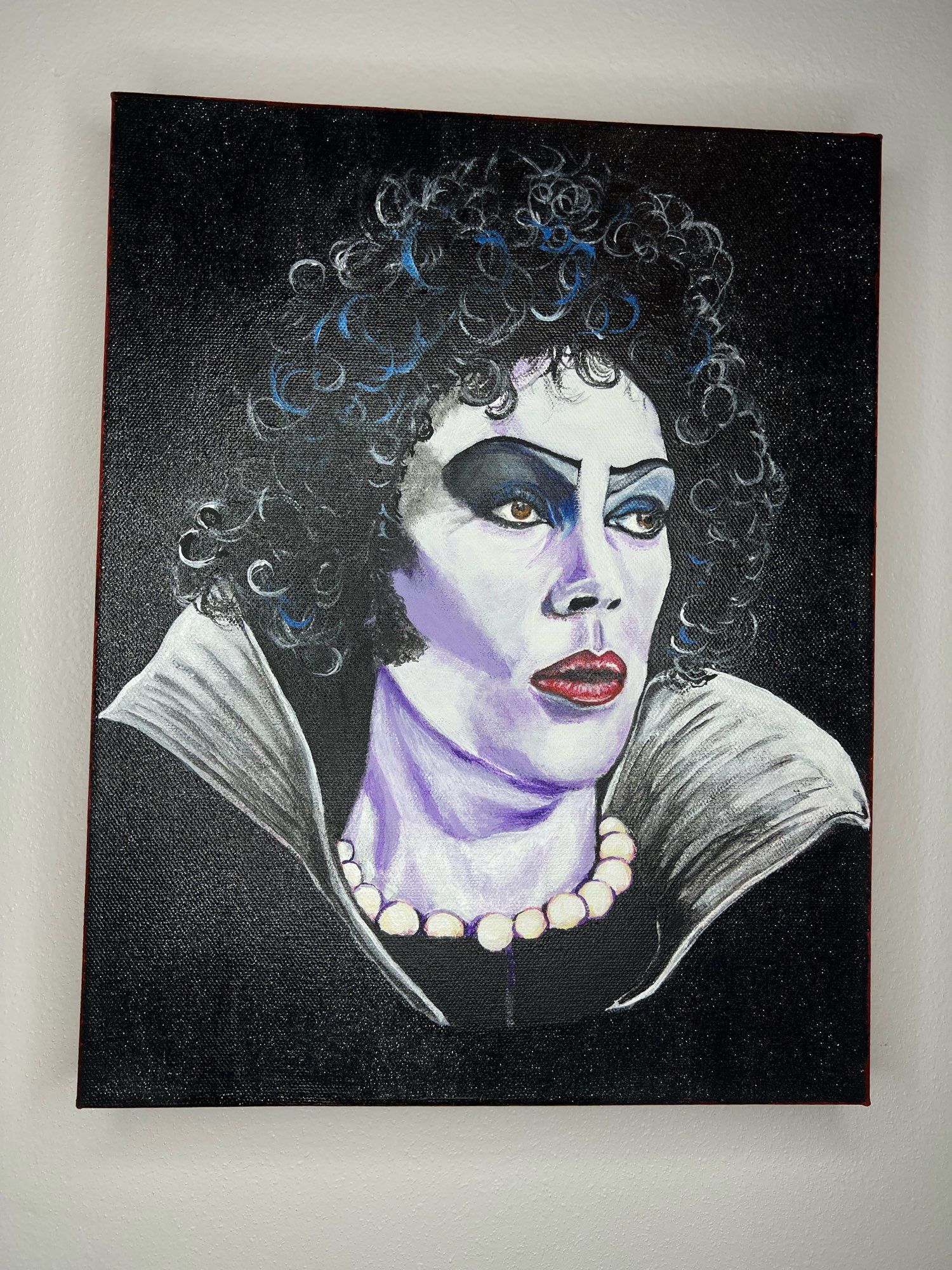 Acrylic painting of Tim Curry in The Rocky Horror Picture Show. It’s a side profile view.