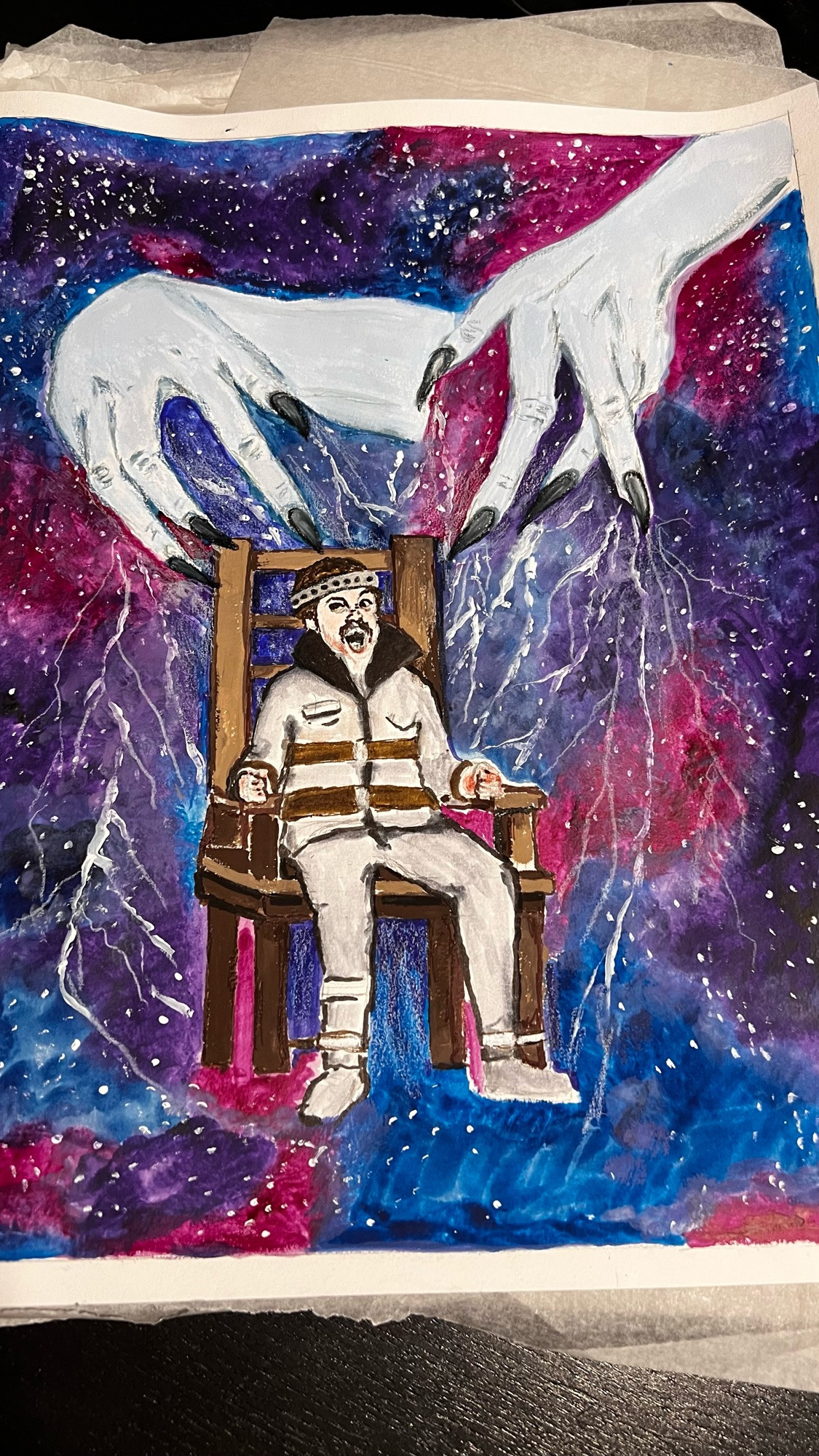 painting of a man in an electric chair, screaming.

There are also witches hands, causing the chair to electrocute him