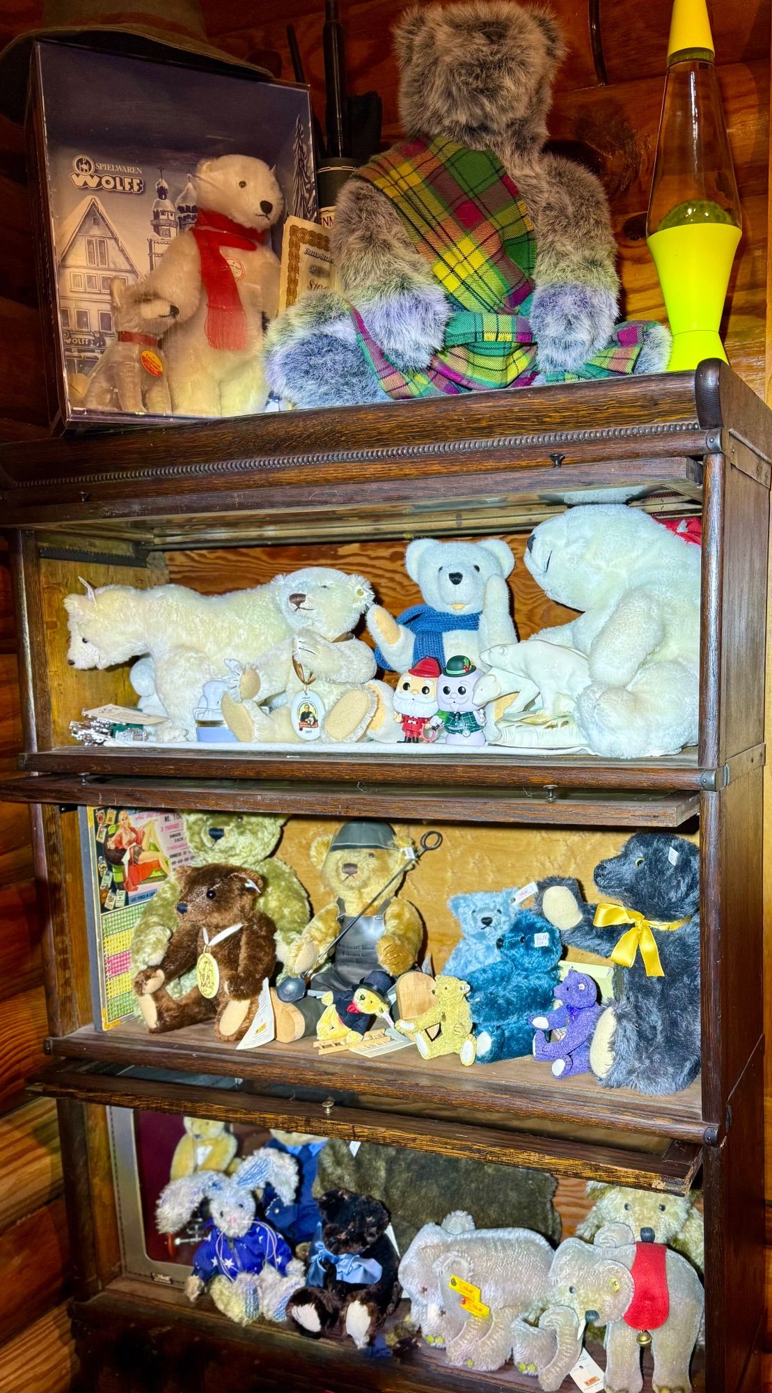 A barristers bookcase with 3 shelves of Steiff (and other) bears.