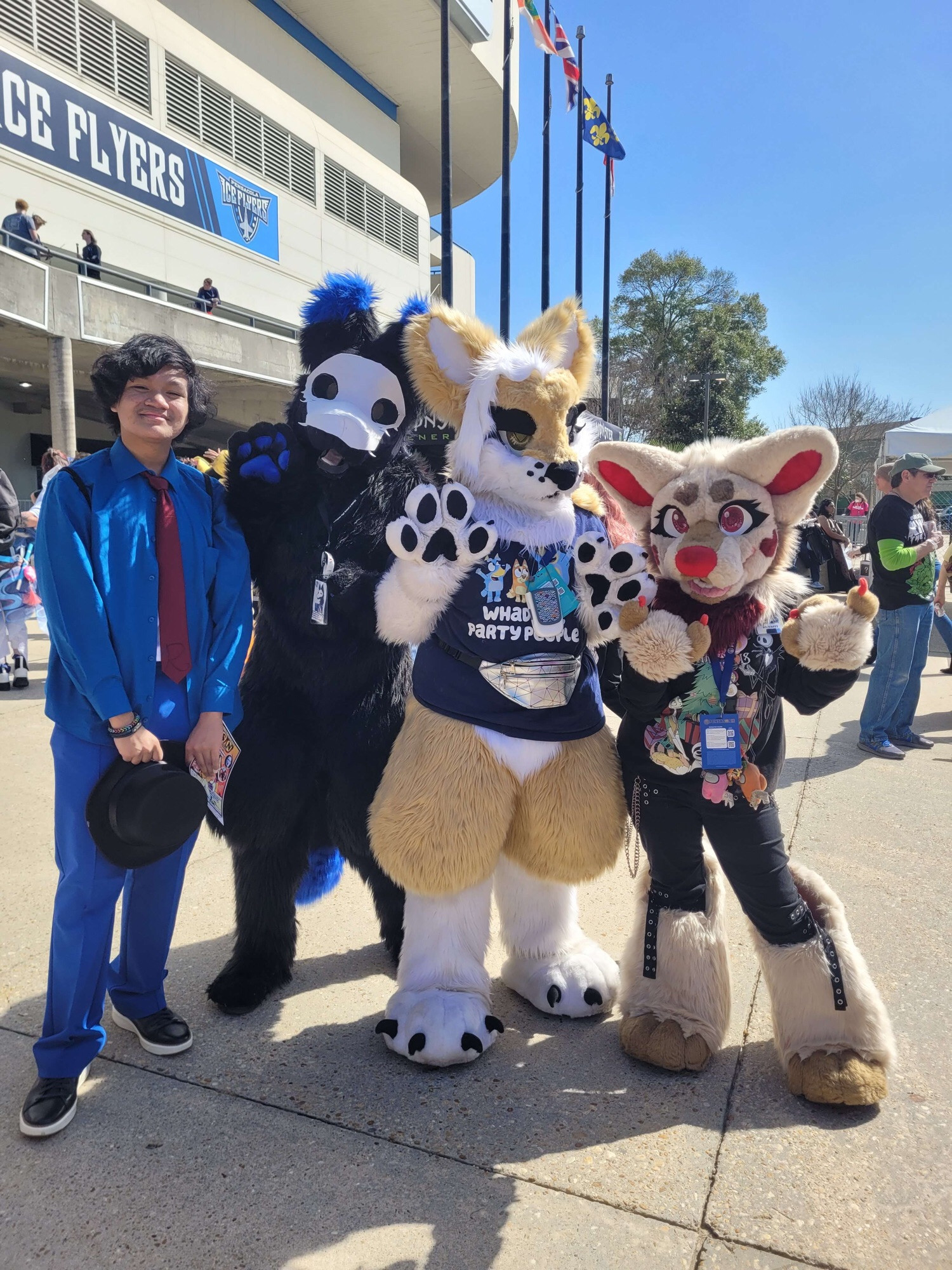 A group photo between a cosplayer, Luki, Winifred, and Squeeks at Pensacon 2024