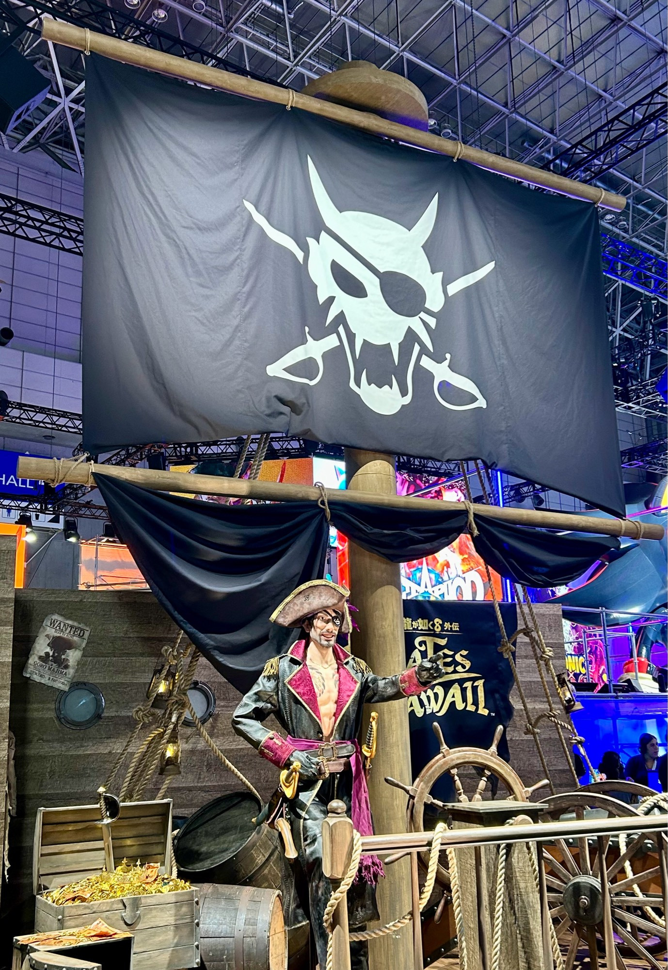 A life-size model of Captain Goro Majima with a pirate mast flying above at Sega’s TGS booth