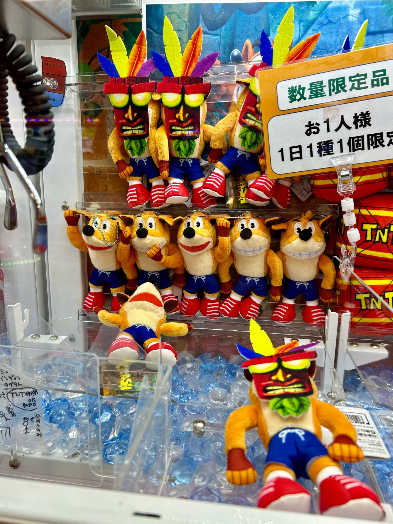 Crash bandicoot toys inside a crane game machine