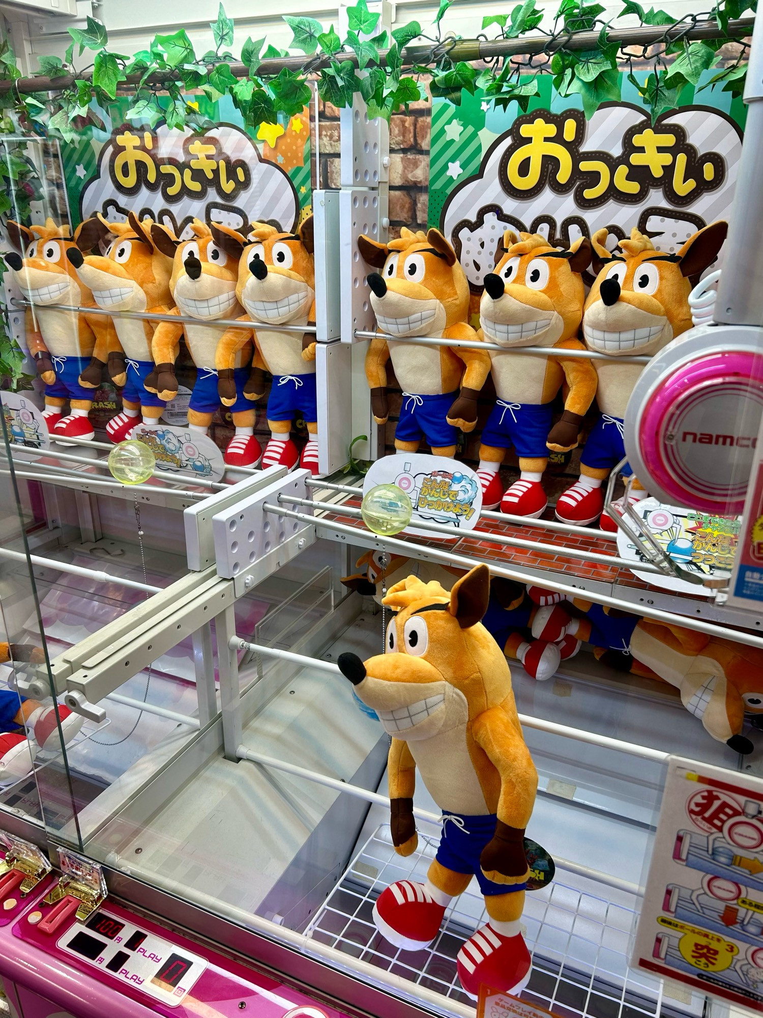 Crash bandicoot toys inside a crane game machine