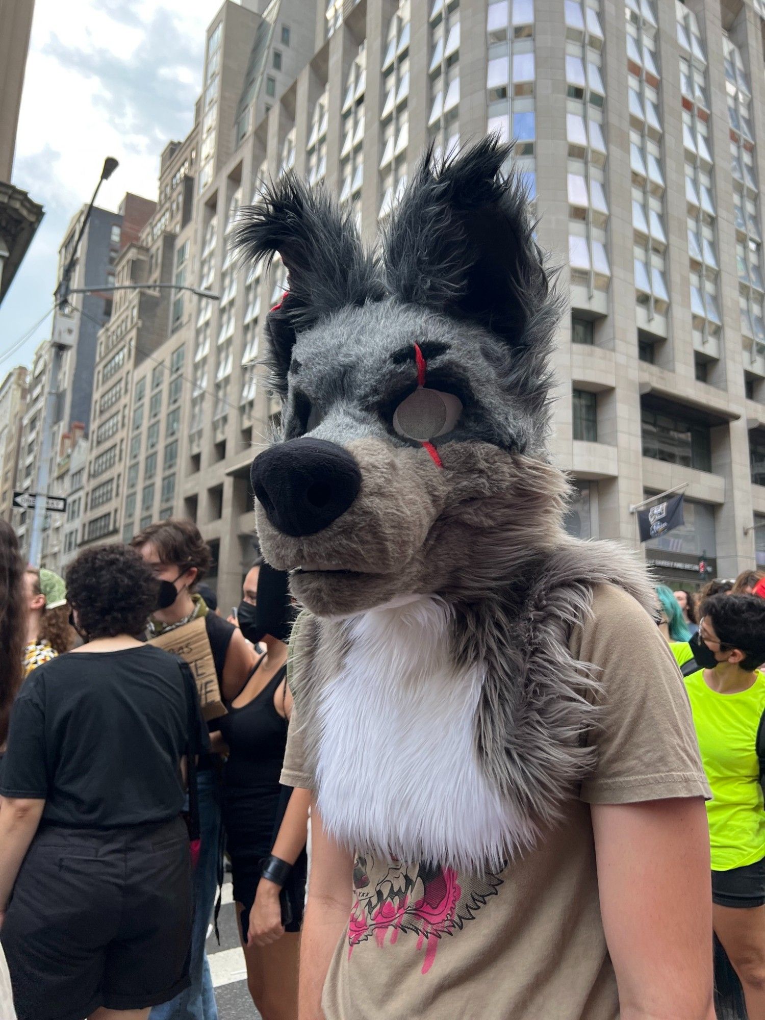 A brown partial fursuiter in the middle of NYC