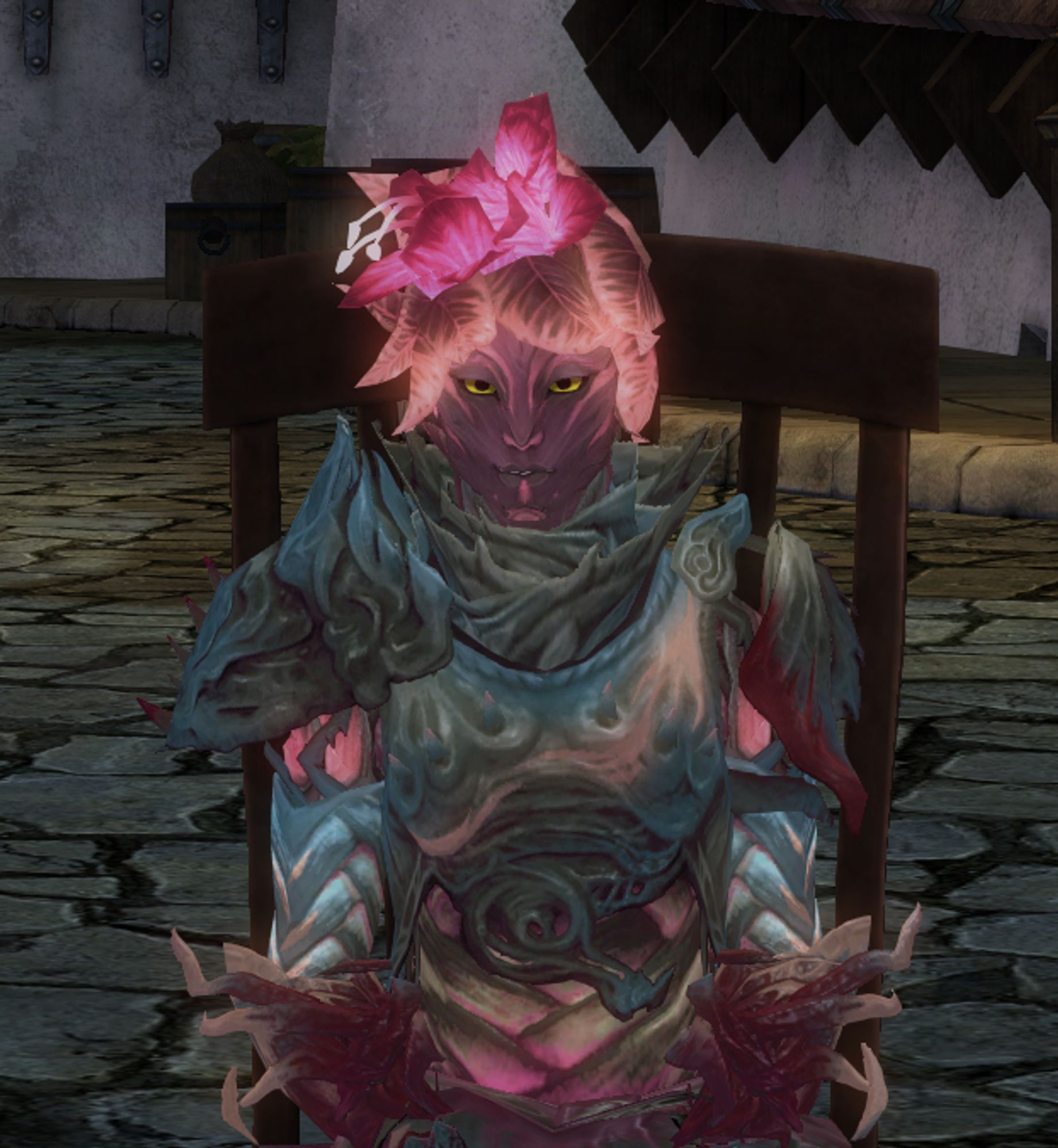 My Sylvari Guardian, Johannes (whose name may change if I come up with a better one), sitting in a chair and glowing.